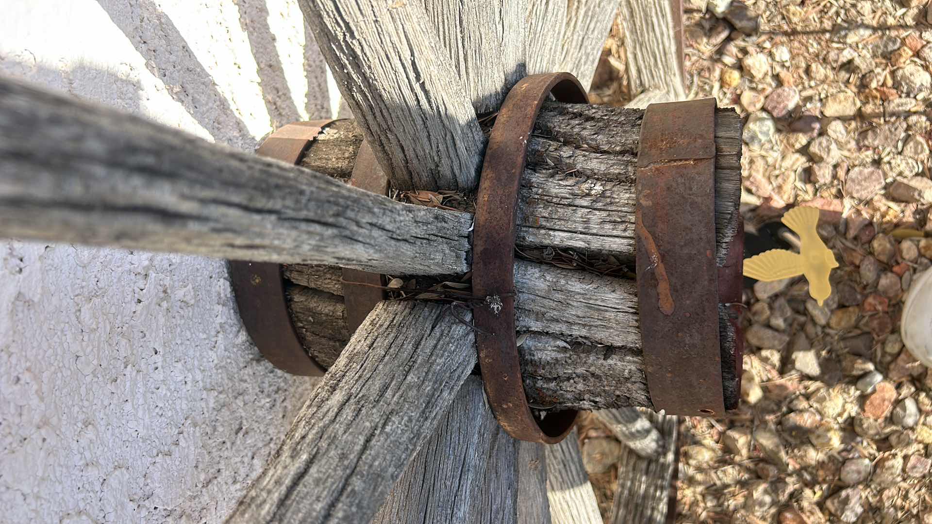 Photo 3 of ANTIQUE WOOD AND FORGED BRONZE WAGON WHEEL 42”