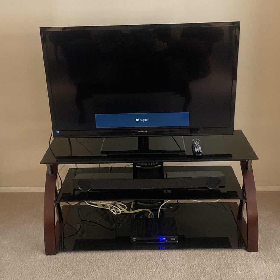 Photo 1 of TOSHIBA 46” TV WITH STAND AND YAMAHA SOUND BAR. INCLUDES COX REMOTE & TOSHIBA REMOTE STAND MEASURES 48” x 18” x 21 1/2”