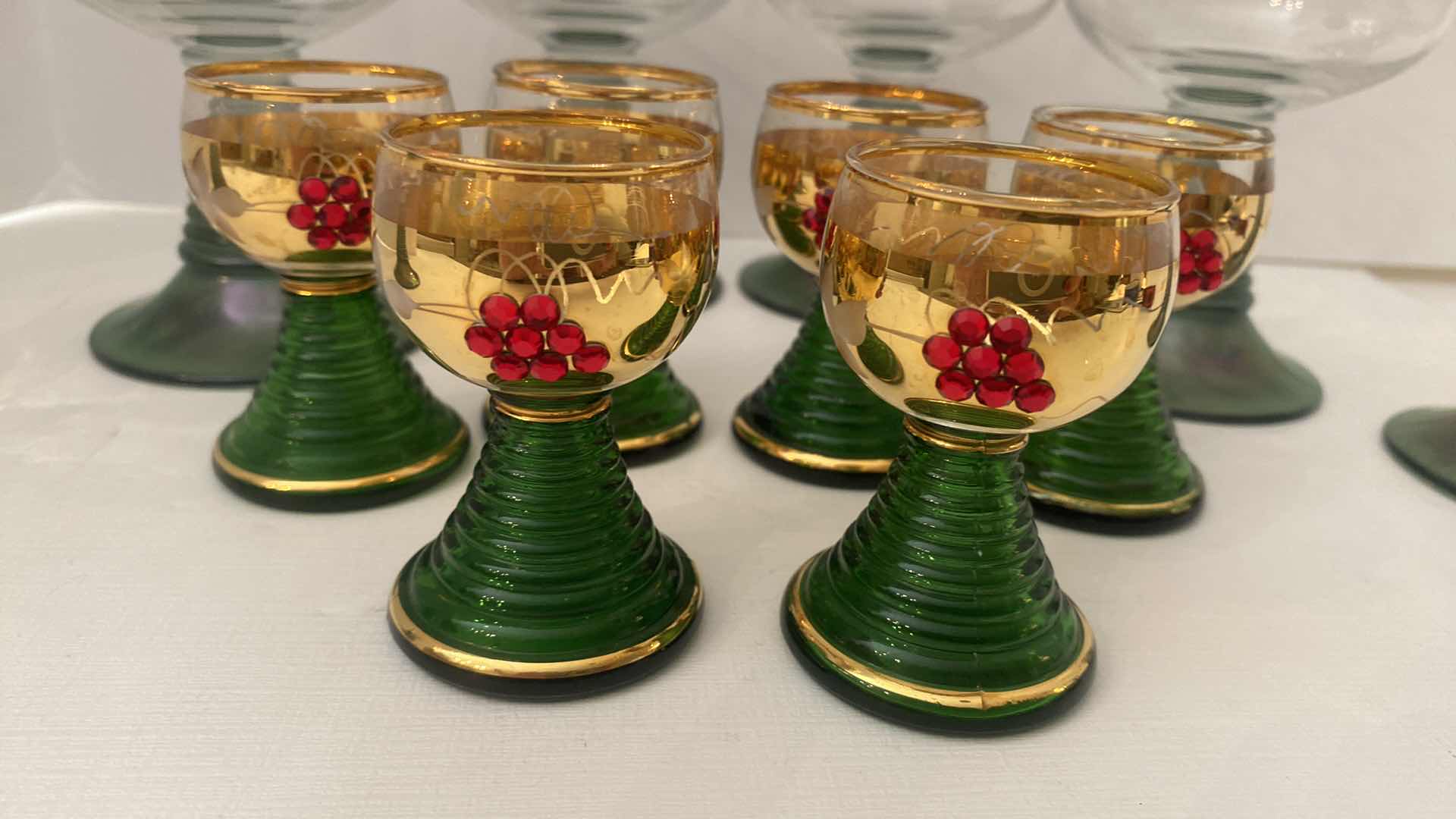 Photo 5 of VINTAGE GERMAN ROEMER GREEN AND GOLD RIMMED WINE GLASSES AND GOLD JEWELED SHOT GLASSES