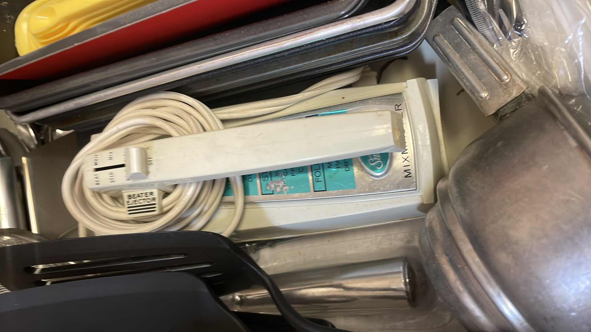 Photo 3 of CONTENTS OF KITCHEN DRAWER-BAKEWARE, HAND MIXER, UTENSILS