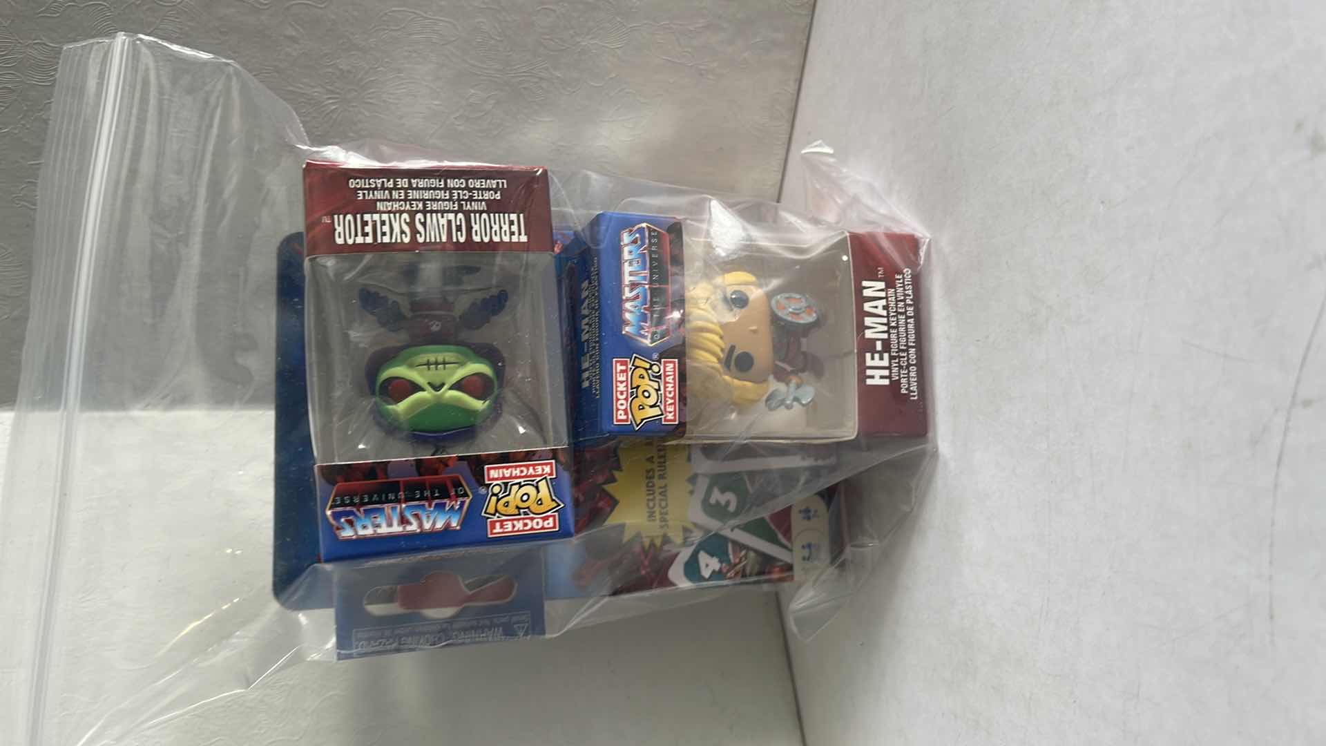 Photo 1 of NIB FUNKO POP POCKET KEYCHAIN MASTERS OF THE UNIVERSE DIFFERENT SET OF (2) WITH UNO PLAYING CARDS