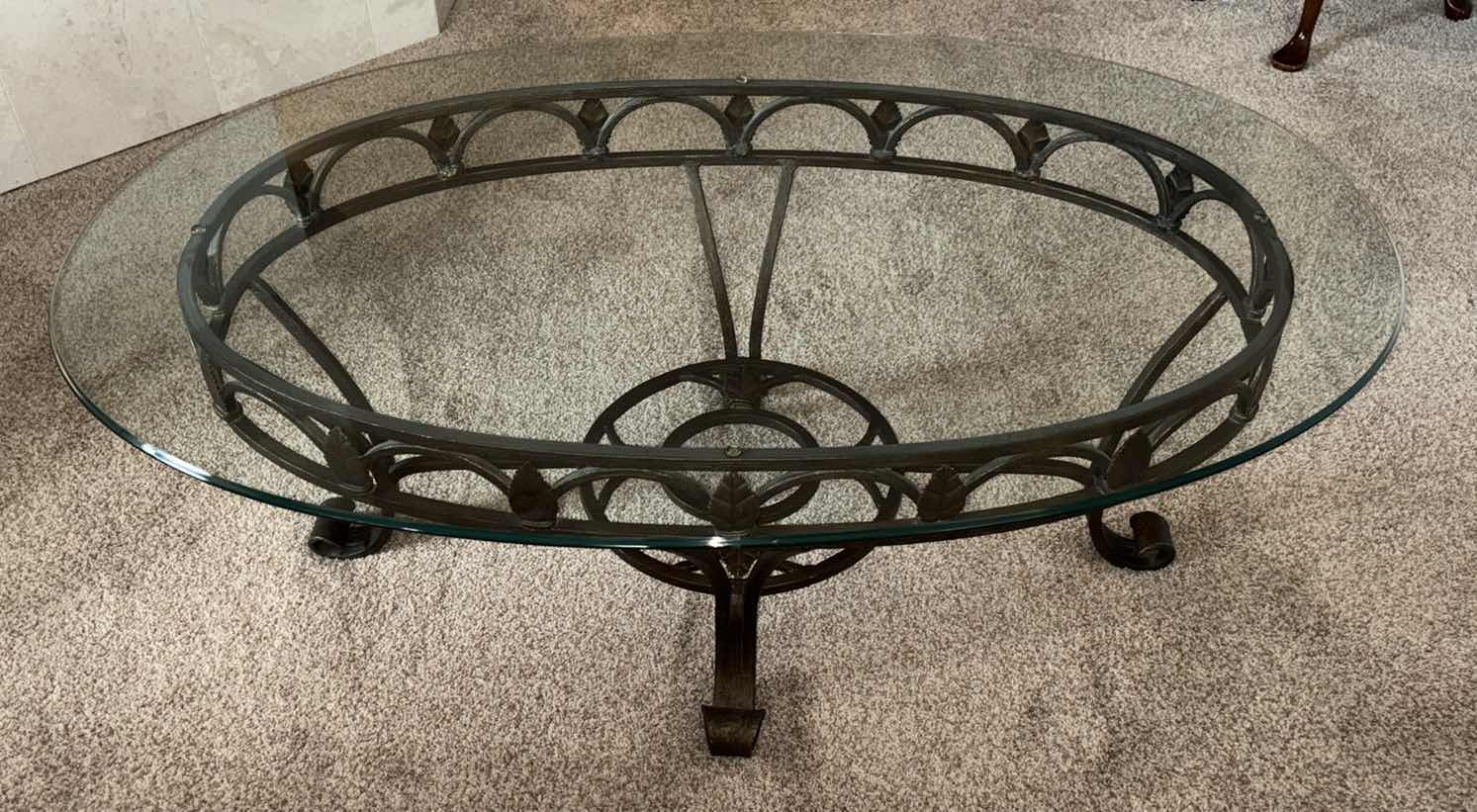 Photo 1 of TARNISHED BRONZE LEAF WROUGHT IRON COFFEE TABLE W OVAL GLASS TOP 31.75” X 47.75” H18”