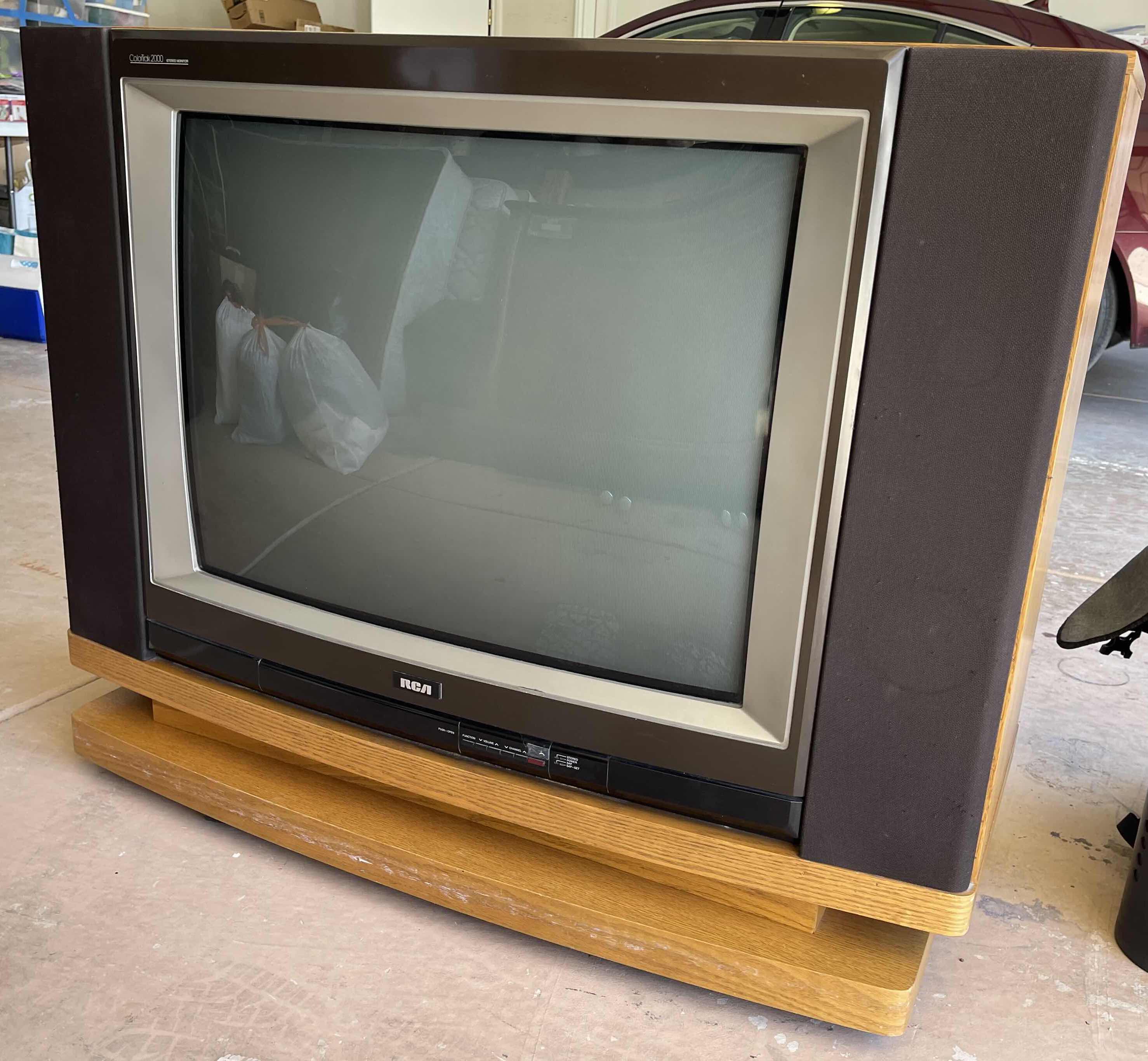 Photo 1 of RCA 32” COLORTRAK 2000 STEREO MONITOR CONSOLE WITH WHEELS, CONSOLE 15” X 42” H35” (MODEL G31150CK)