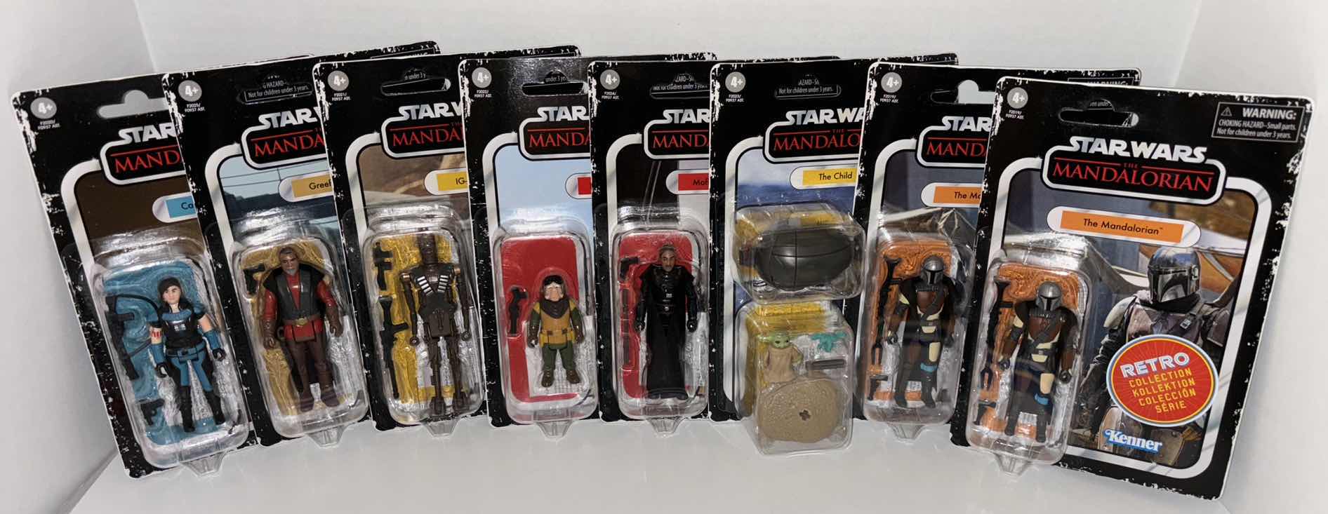 Photo 1 of NEW ASSORTED 8-PACK CASE HASBRO KENNER STAR WARS THE RETRO COLLECTION ACTION FIGURE & ACCESSORIES, "THE
MANDALORIAN ASSORTED SET OF
8"