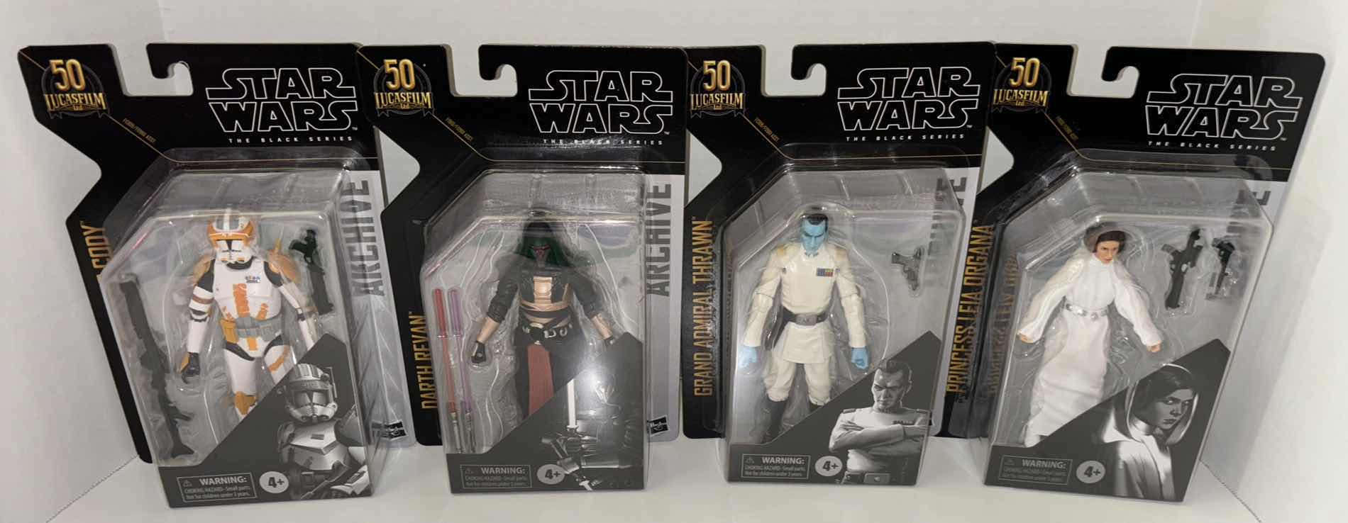 Photo 1 of NEW ASSORTED 4-PACK HASBRO STAR WARS THE BLACK SERIES 50TH ANNIVERSARY ARCHIVE ACTION FIGURE & ACCESSORIES, "CLONE COMMANDER CODY, DARTH REVAN, GRAND ADMIRAL THRAWN & PRINCESS LEIA ORGANA"