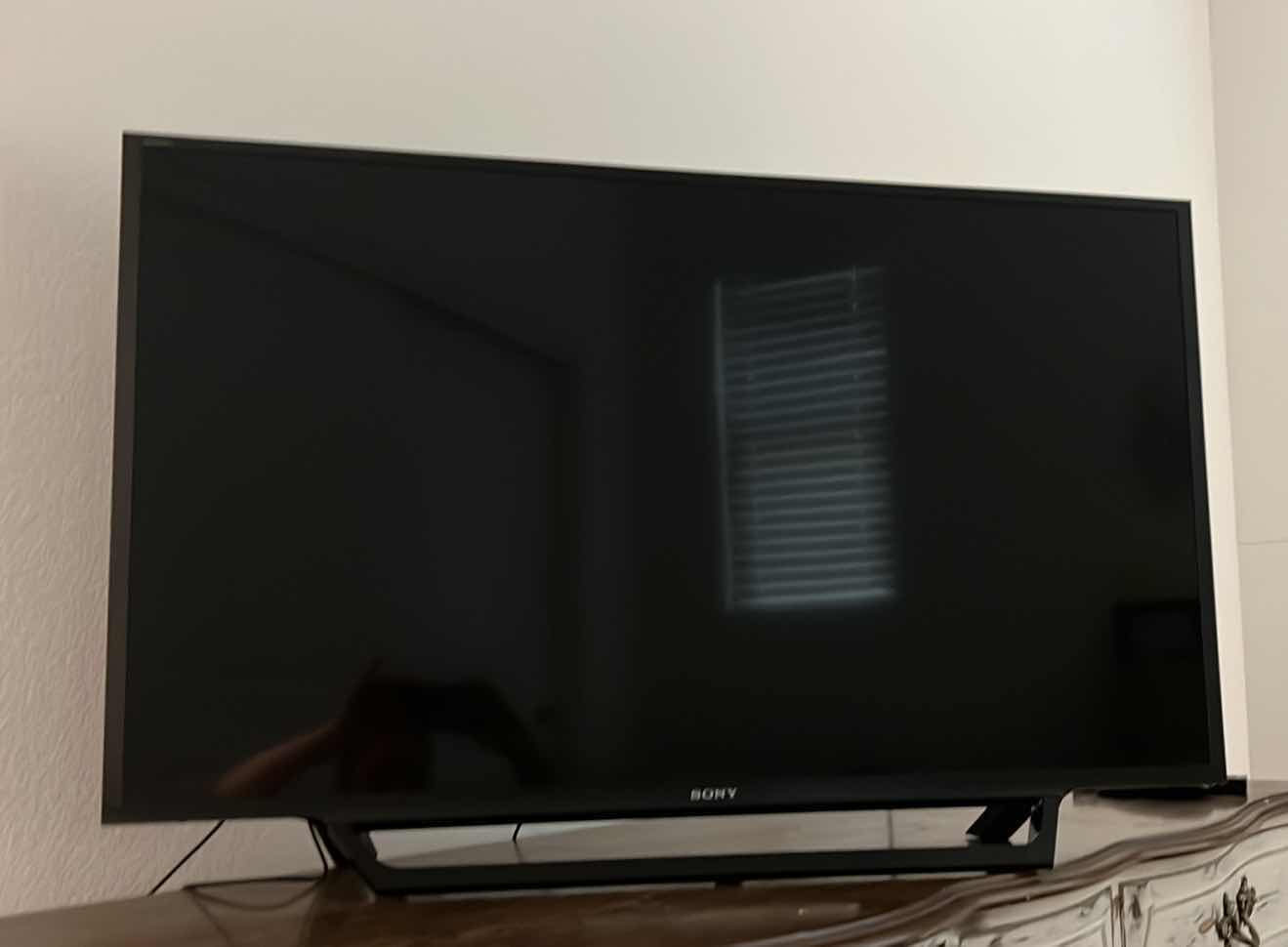 Photo 1 of ELECTRONICS-42” SONY FLATSCREEN TV WITH STAND. AMAZON FIRE STICK WITH REMOTES INCLUDED.