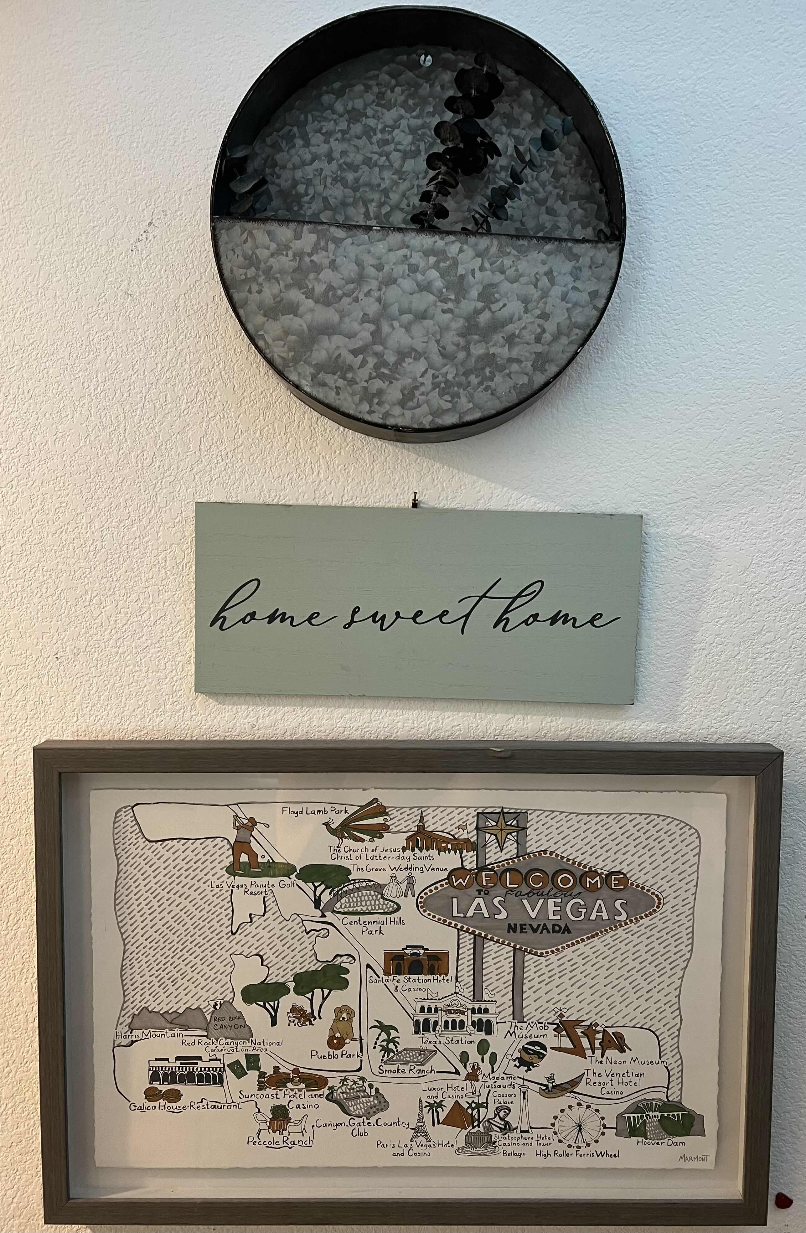 Photo 1 of WALL ART-GREY FRAMED LAS VEGAS MAP 24“ x 16“. HOME SWEET HOME WOODEN SIGN 15” x 6”. ROUND ALUMINUM WALL PLANTER WITH FAUX PLANTS.