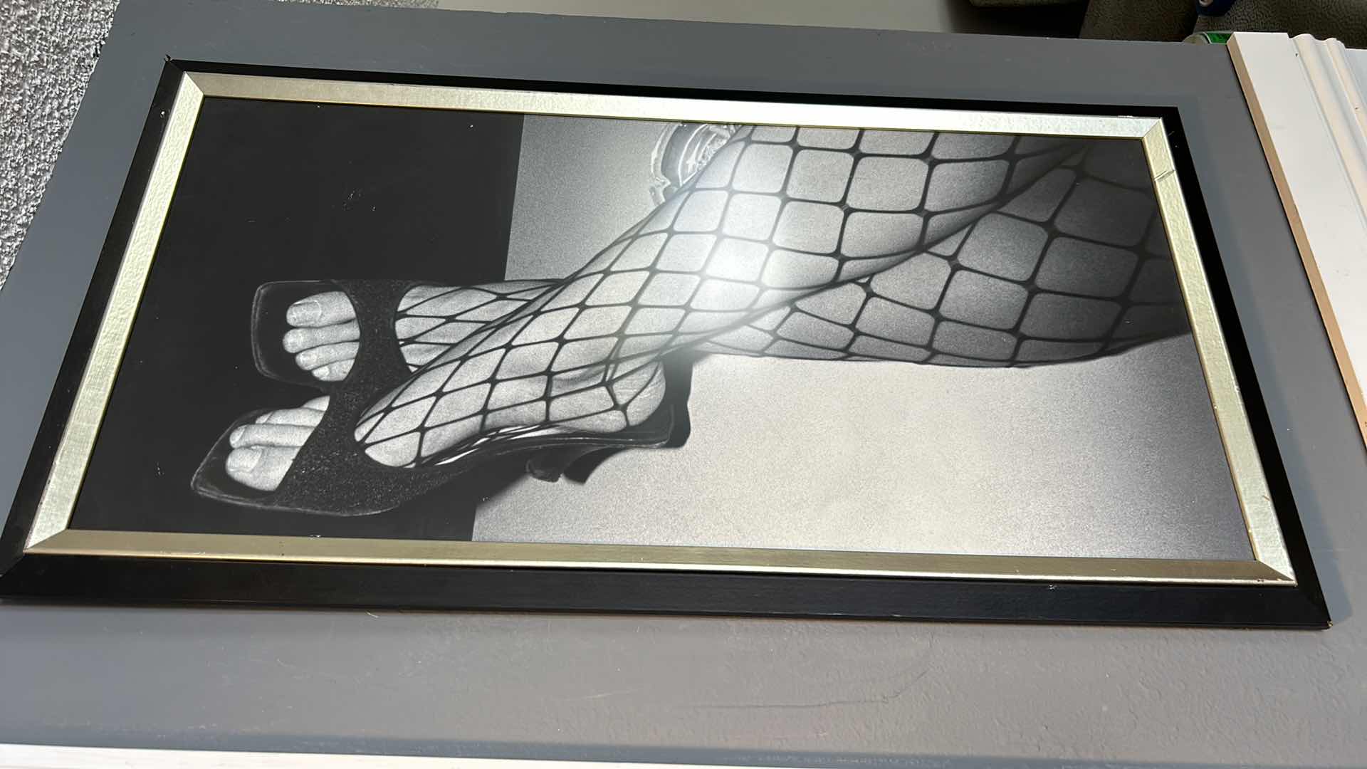 Photo 2 of BLACK AND GOLD FRAMED PRINT. “BLACK FISHNET STOCKINGS” ARTWORK 19" X H35.5".