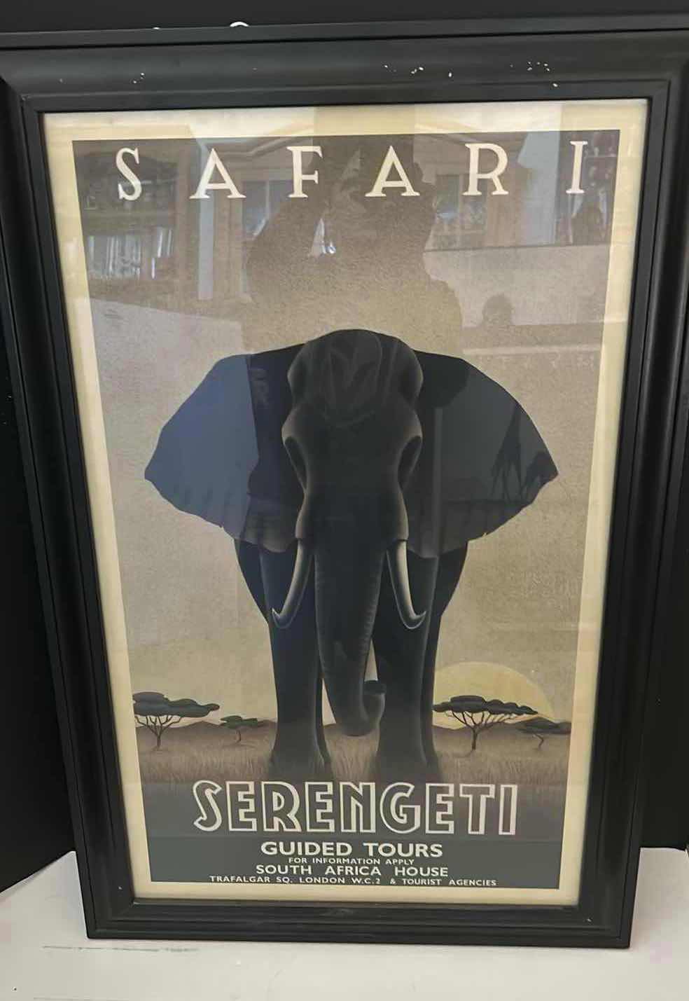 Photo 1 of BLACK FRAMED SERENGETI GUIDED TOURS ELEPHANT SAFARI ARTWORK. 20 1?2” X H 32”.