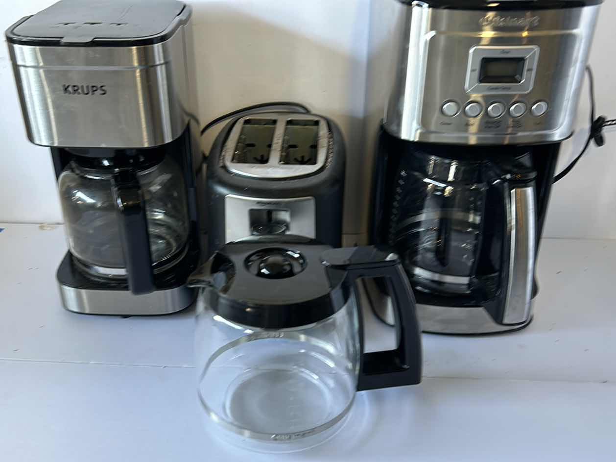 Photo 1 of HOUSEHOLD APPLIANCES. TWO COFFEE MAKERS, AN EXTRA COFFEE POT, AND A TOASTER.