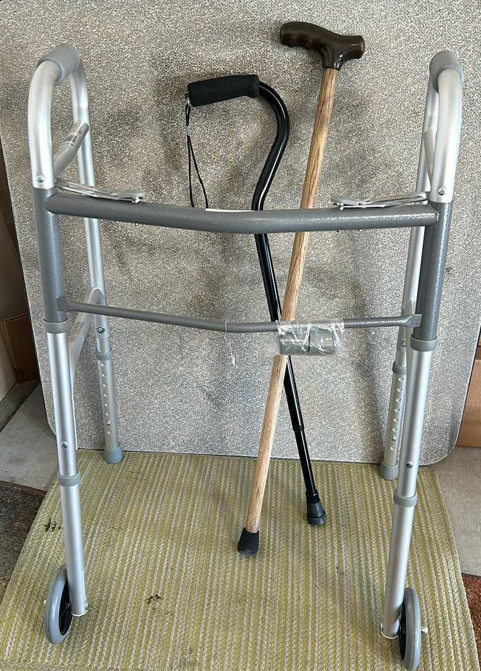 Photo 1 of NEW GUARDIAN 2 BUTTON FOLDING WALKER AND 2 CANES