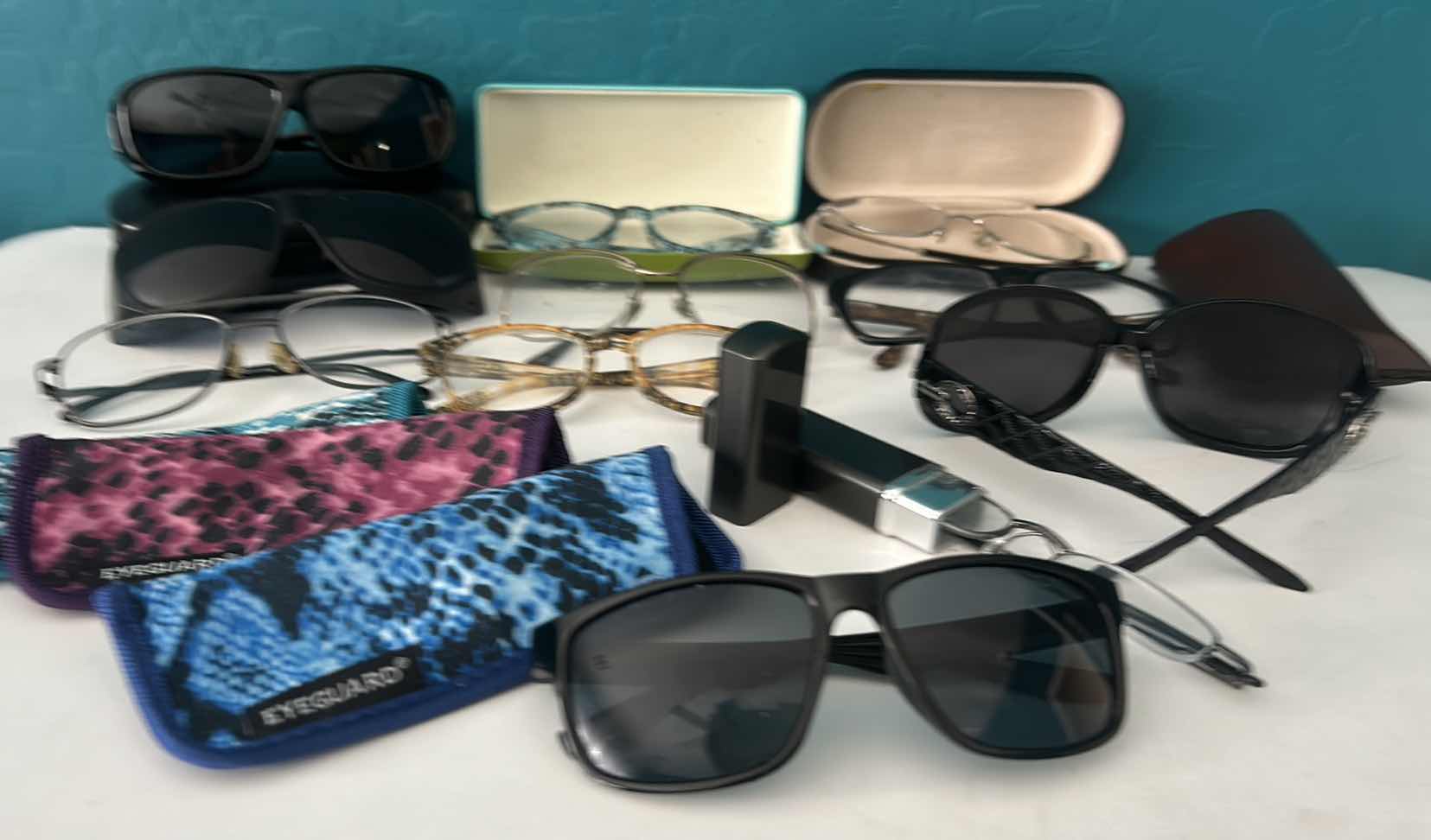 Photo 1 of EYEGLASSES AND SUNGLASSES WITH ASSORTED CASES.