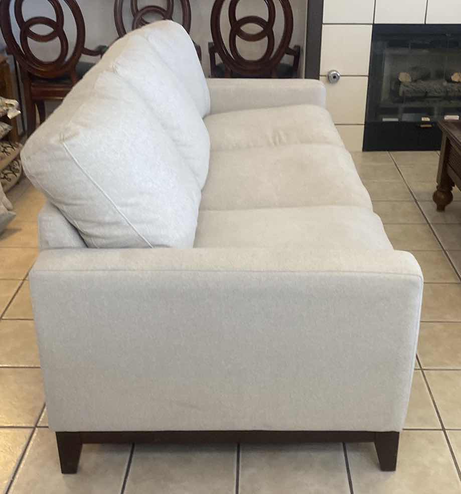 Photo 2 of 7’ OATMEAL COLOR FABRIC SOFA WITH WOOD LEGS WITH 2 TOSS PILLOWS (2 available each sold separately)