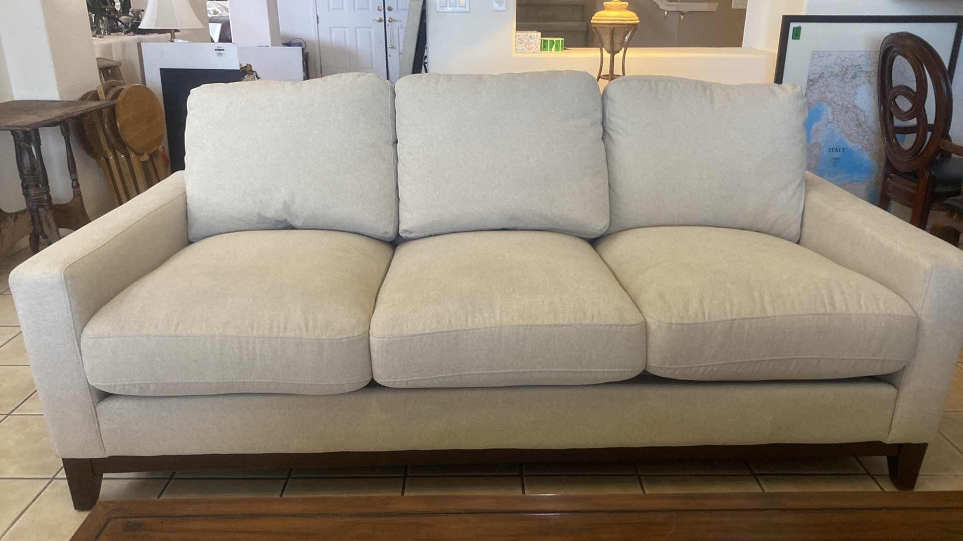 Photo 1 of 7’ OATMEAL COLOR FABRIC SOFA WITH WOOD LEGS WITH 2 TOSS PILLOWS (2 available each sold separately)