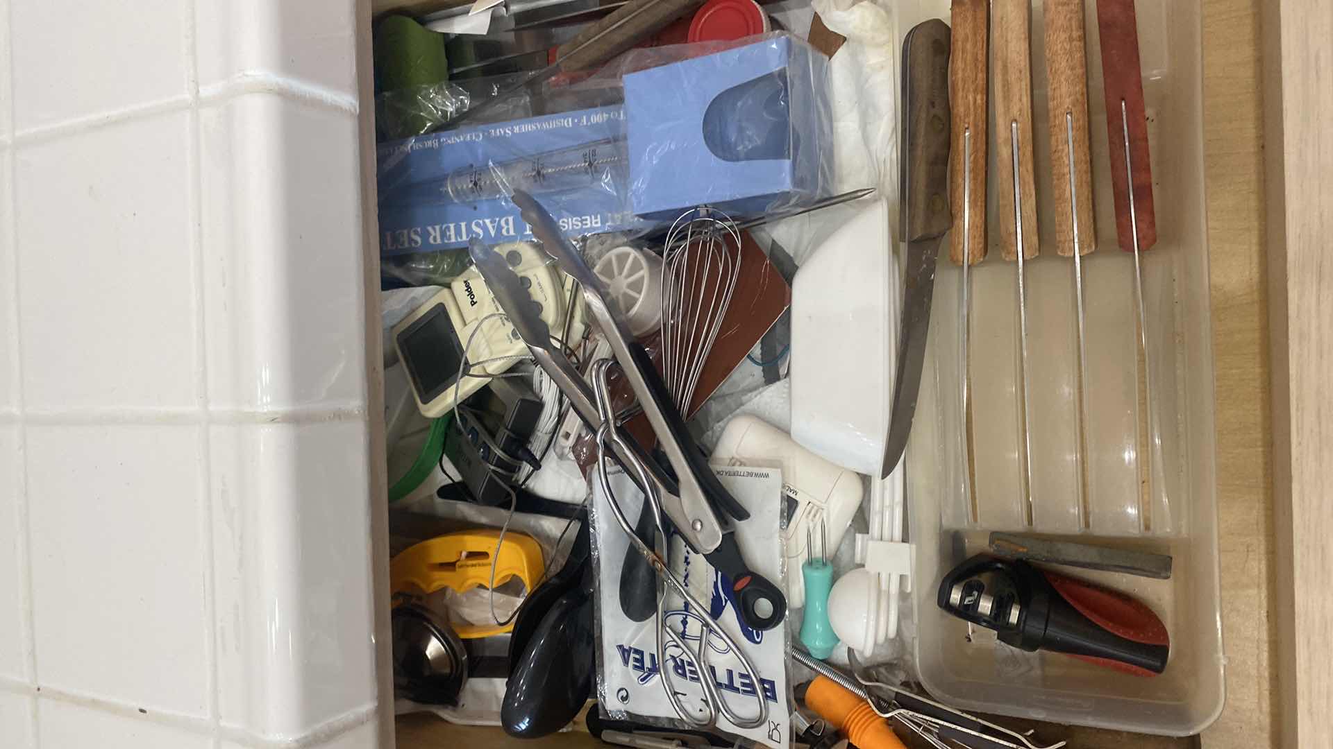 Photo 2 of CONTENTS OF KITCHEN CABINET & 1 DRAWER - KNIVES & TOOLS & PLASTIC STORAGE