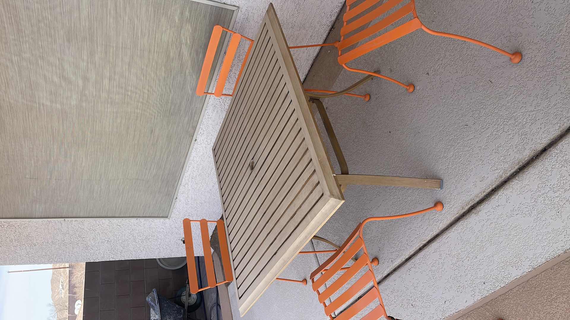 Photo 3 of OUTDOOR ALUMINUM TABLE 45”x45” H28” FOUR ORANGE CHAIRS