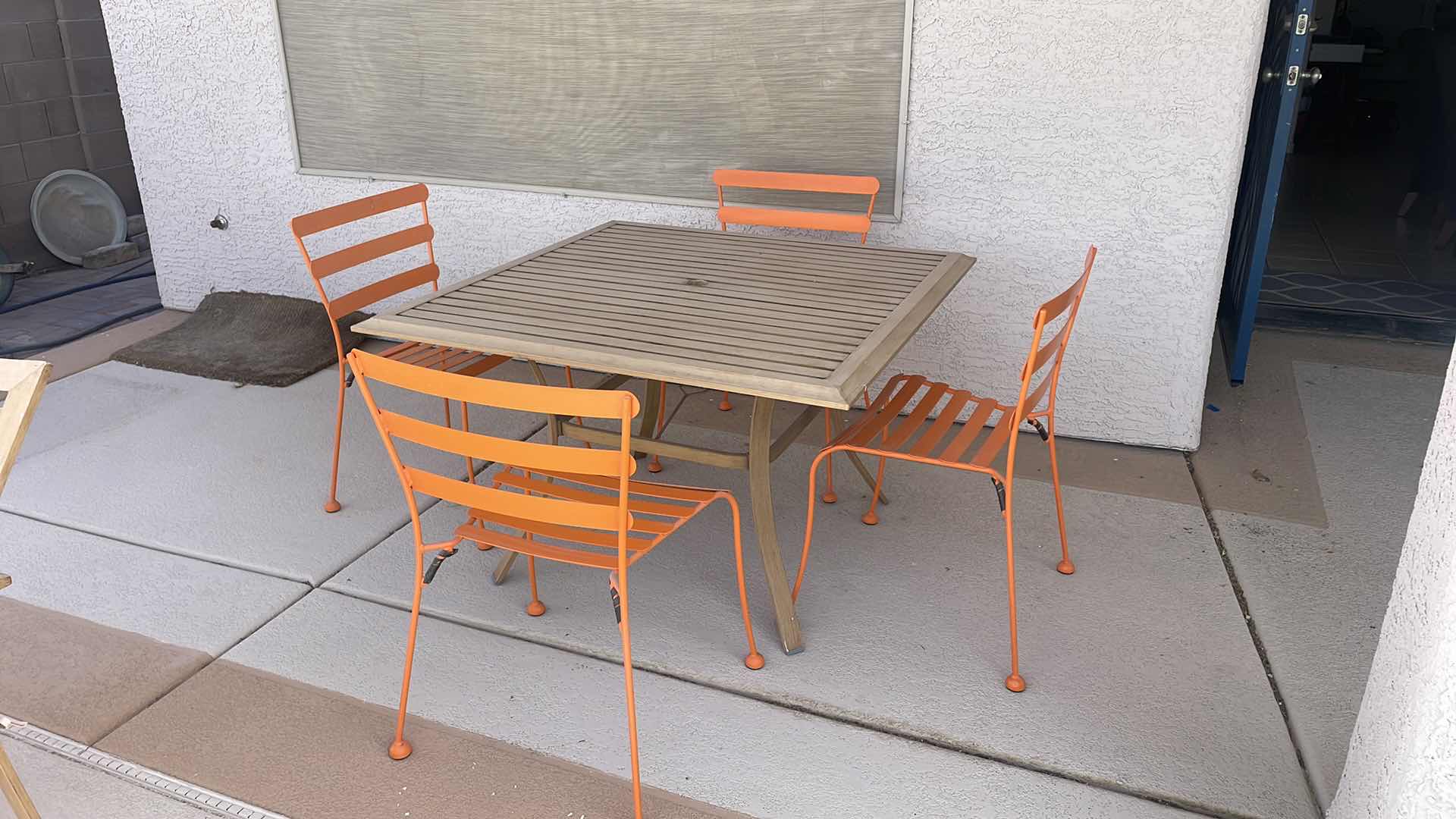 Photo 1 of OUTDOOR ALUMINUM TABLE 45”x45” H28” FOUR ORANGE CHAIRS