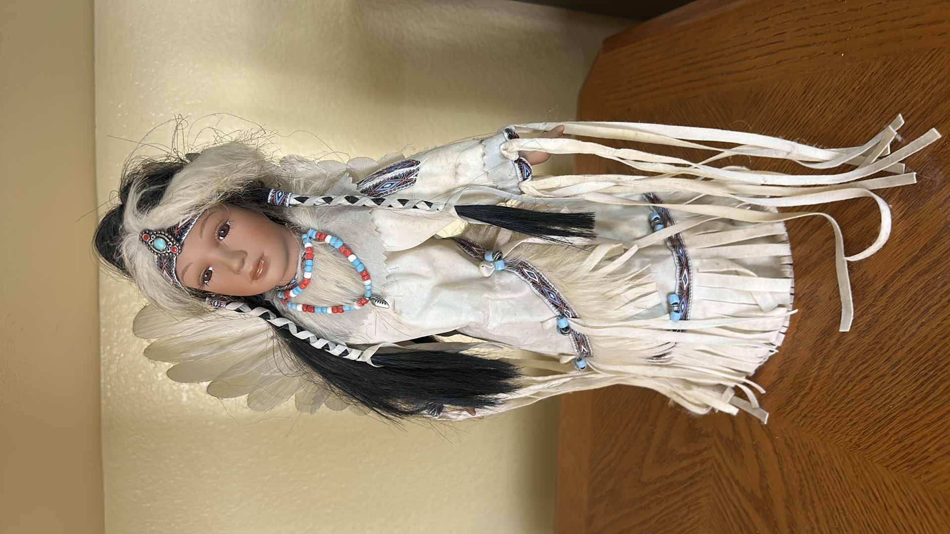 Photo 1 of BATTERY OPERATED HOLLOE BODY PORCELAIN NATIVE AMERICAN DOLL H15”