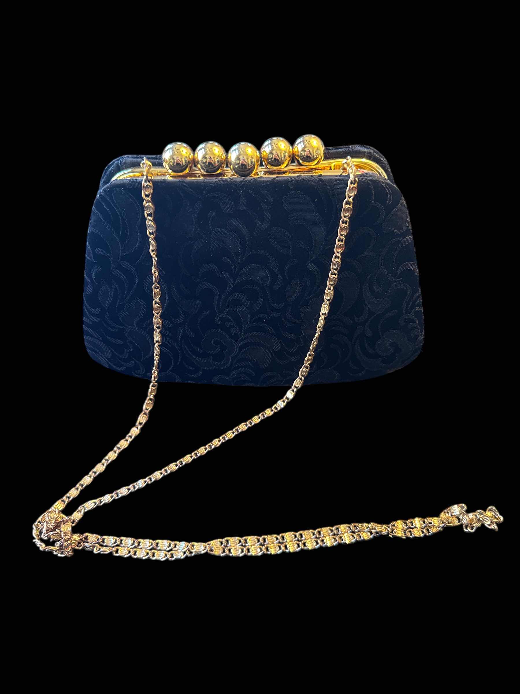 Photo 1 of VINTAGE CLUTCH PURSE BLACK AND GOLD

H6”