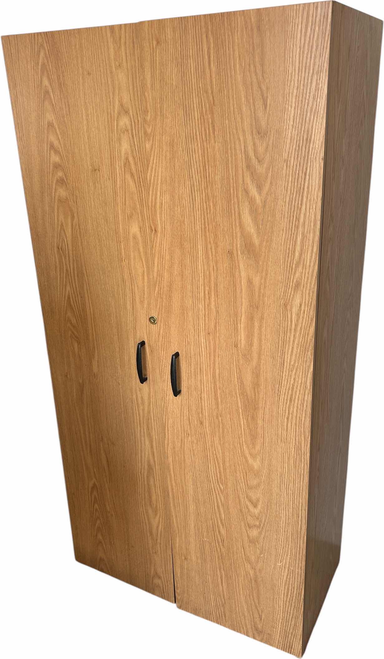 Photo 1 of PARTICLE WOOD STORAGE CABINET 29“ x 15 1/2“ x H59“
