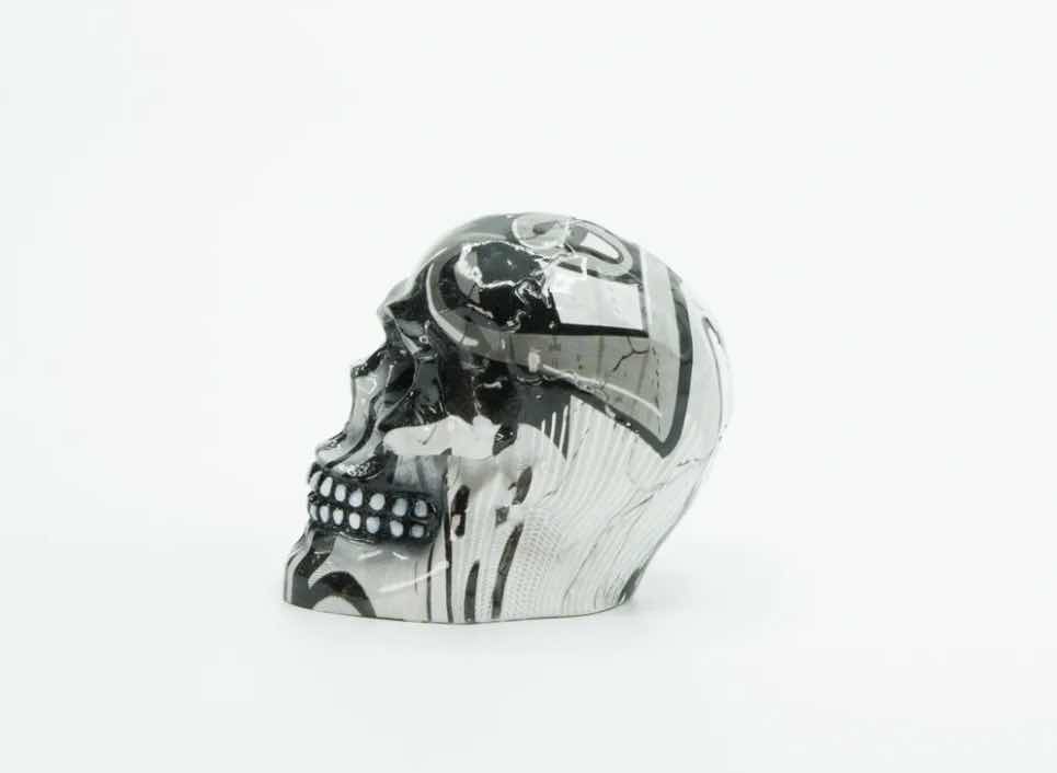 Photo 2 of BRANI BLACK & WHITE SMALL RESIN SKULL 2” x 3” x 3”