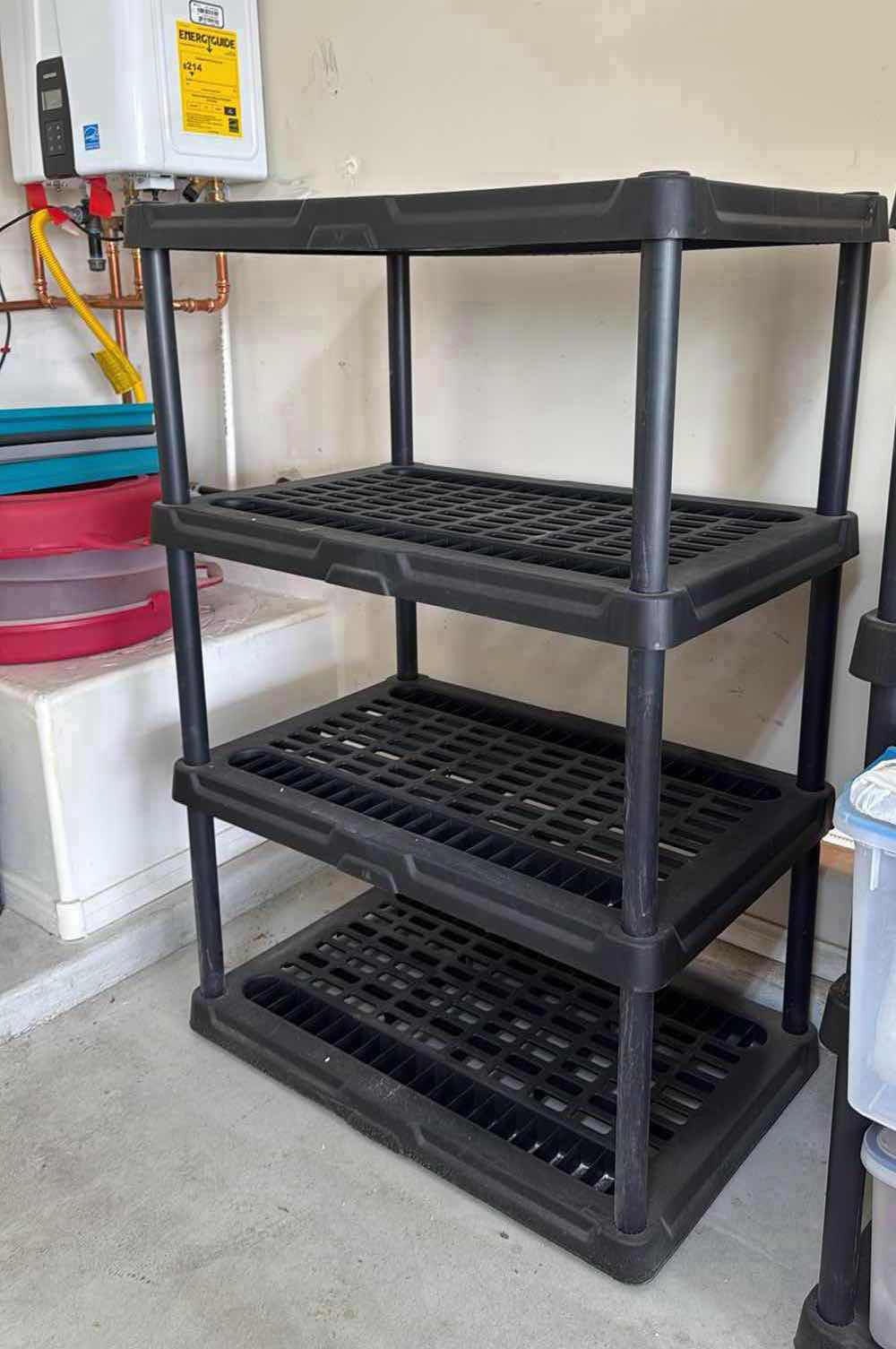 Photo 1 of BLACK HARD PLASTIC SHELVING UNIT 35”x24” H54”