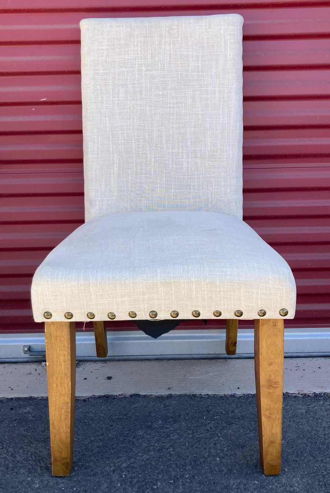 Photo 1 of BEIGE UPHOLSTERY ARMLESS DINING CHAIR W NAILHEAD TRIM AND RUBBERWOOD LEGS 19” X 20” H38.5”