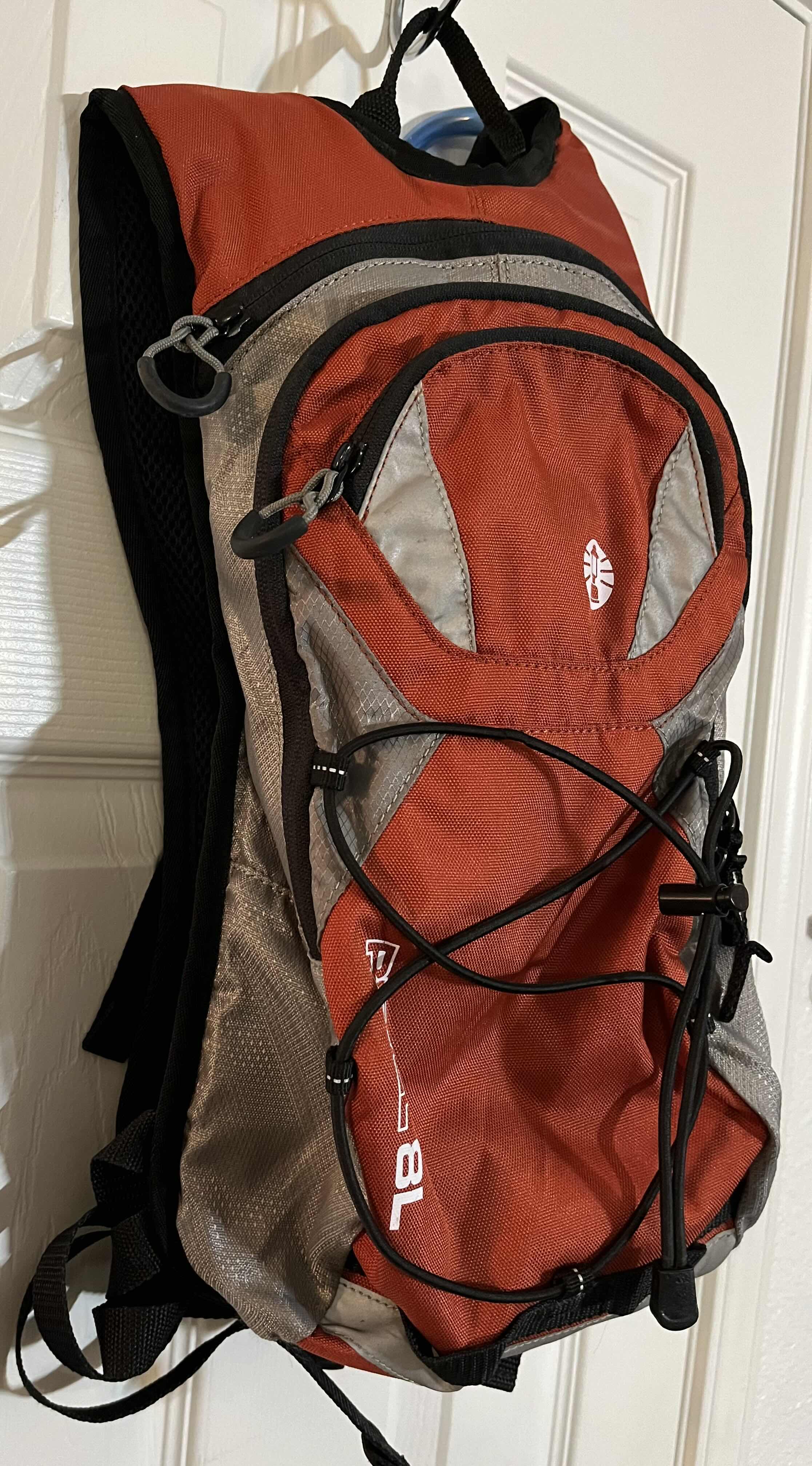 Photo 2 of COLEMAN REVEL 8L ORANGE & GRAY HYDRATION BACKPACK W 2LITER BLADDER