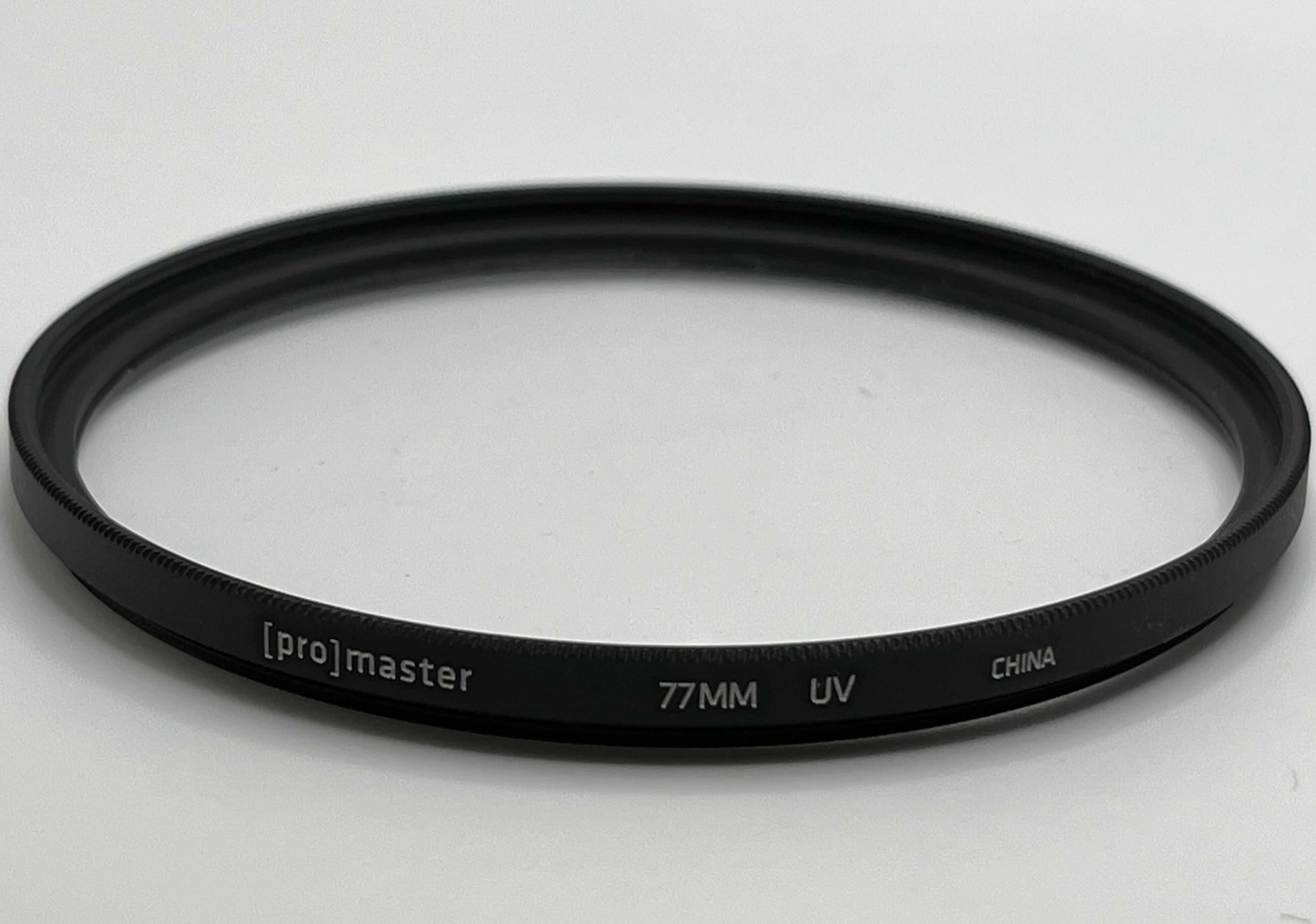 Photo 1 of PROMASTER 77MM UV PROTECTION CAMERA LENS