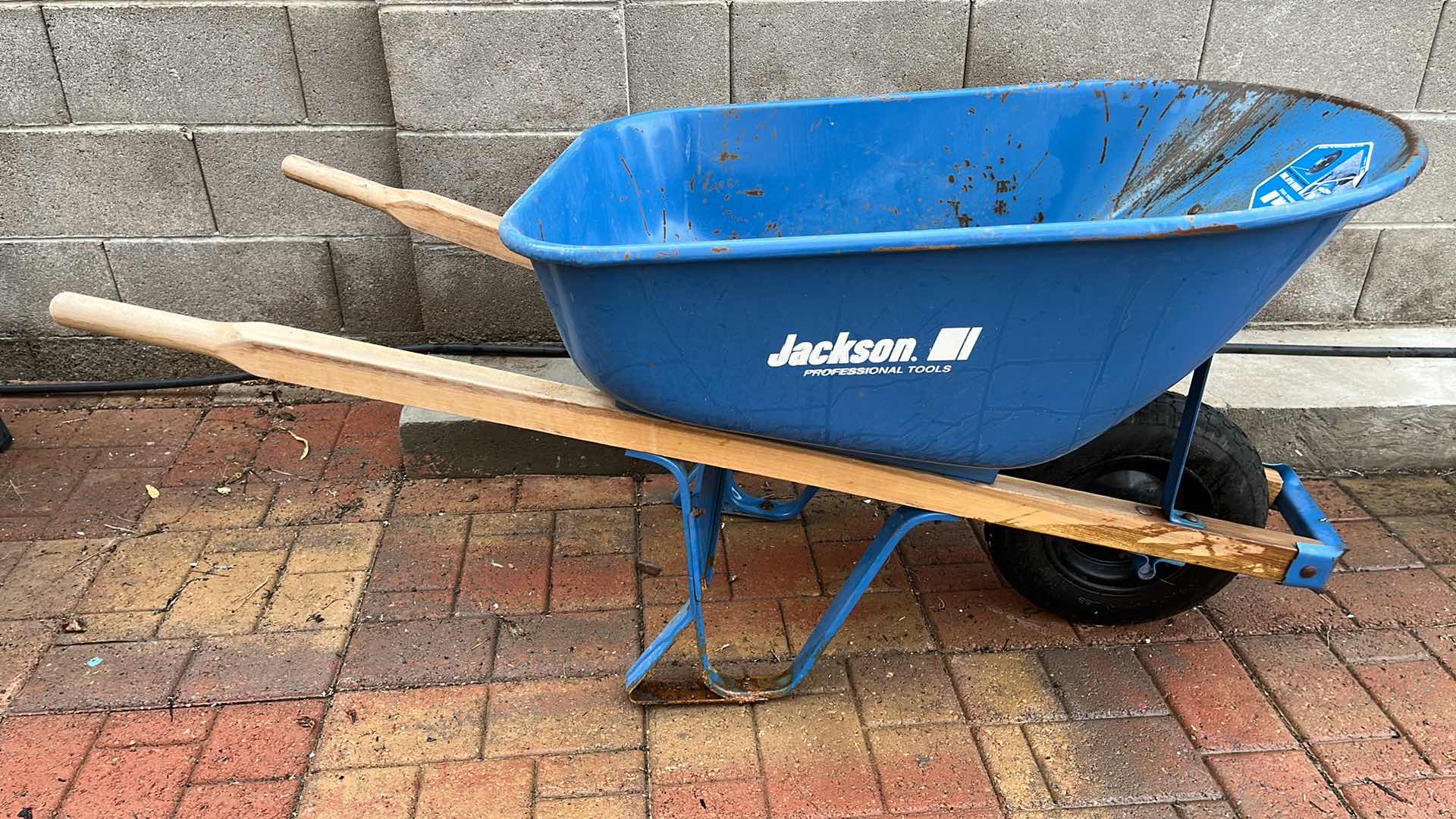 Photo 1 of JACKSON PROFESSIONAL TOOLS BLUE STEEL NEVER FLAT TIRE WHEELBARROW 25” X 60” H28”