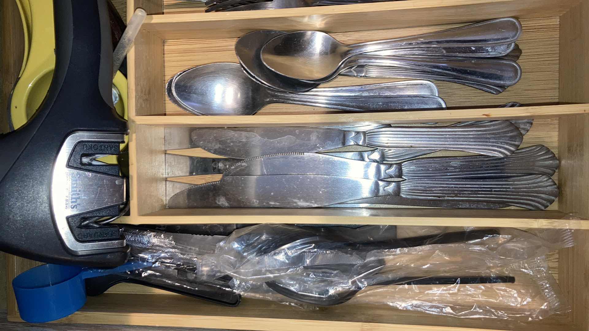 Photo 1 of CONTENTS OF DRAWER- FLATWARE, WOODEN SPOONS & TRAY