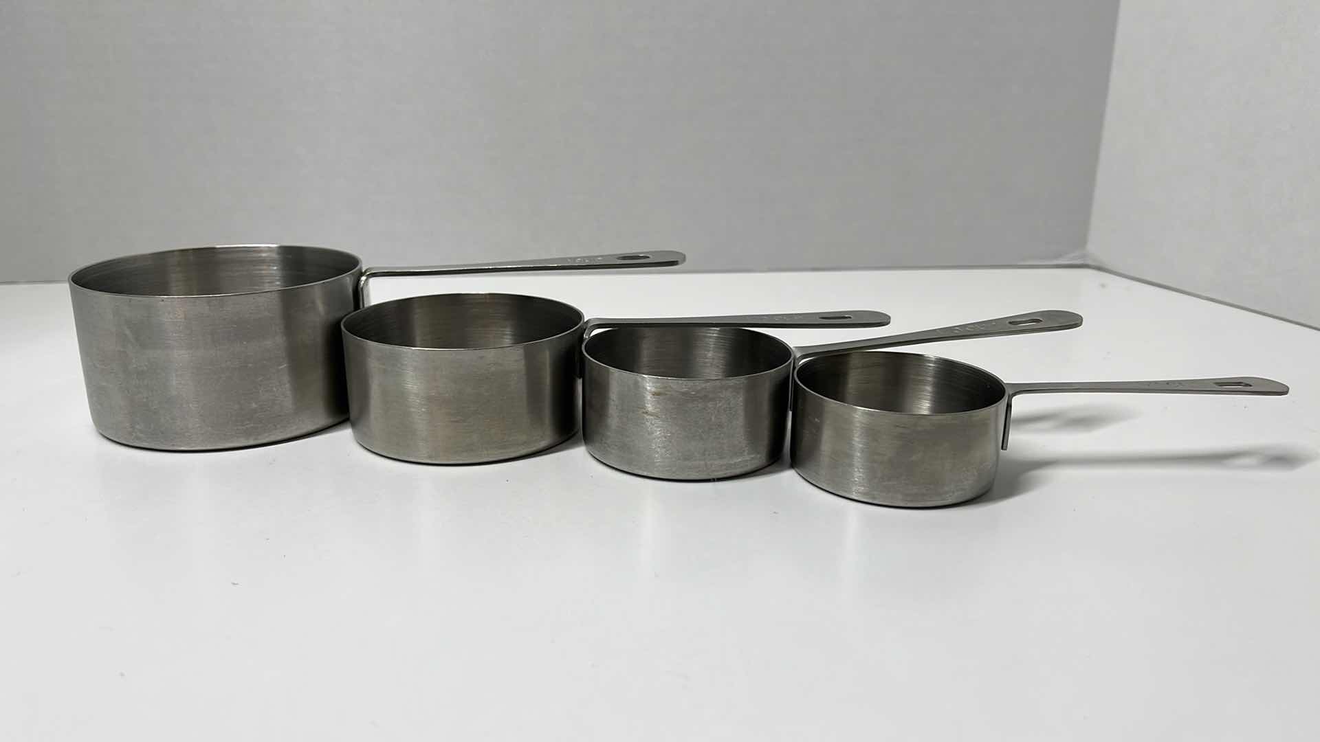 Photo 1 of AMCO STAINLESS STEEL MEASURING CUP SET (4) 1/4CUP-1CUP