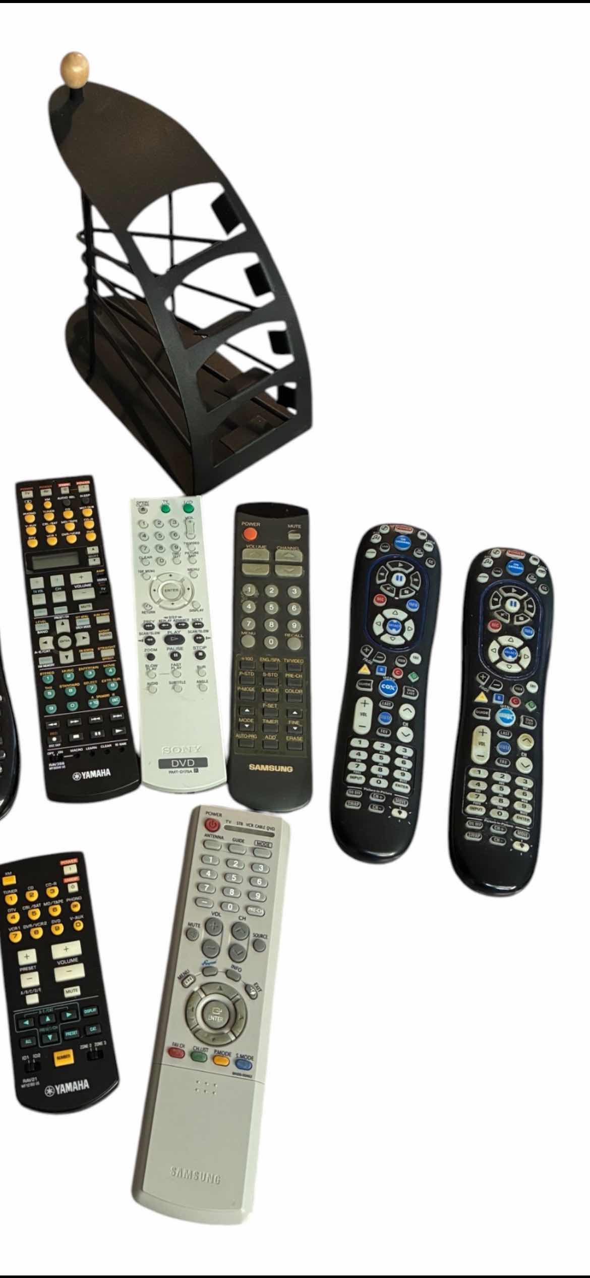 Photo 1 of LOGI HARMONY 665 UNIVERSAL REMOTES & VARIOUS BRAND REMOTES W BLACK METAL REMOTE CADDY
