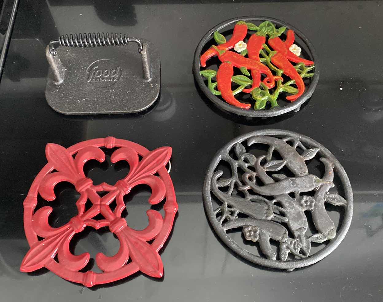 Photo 1 of METAL TRIVETS AND FOOD NETWORK PRESS