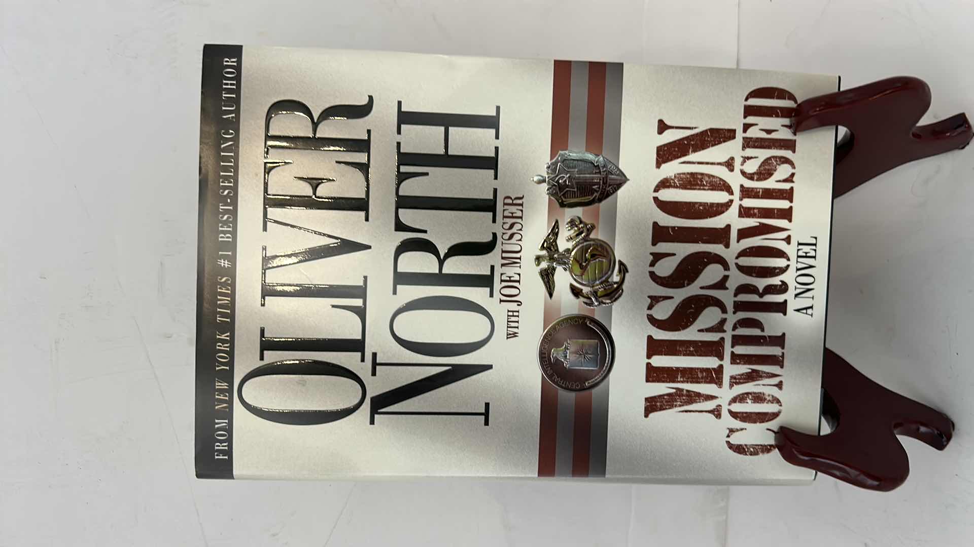 Photo 1 of AUTOGRAPHED HARDCOVER BOOK, “OLIVER NORTH MISSION COMPROMISED” BY JOE MUSSER