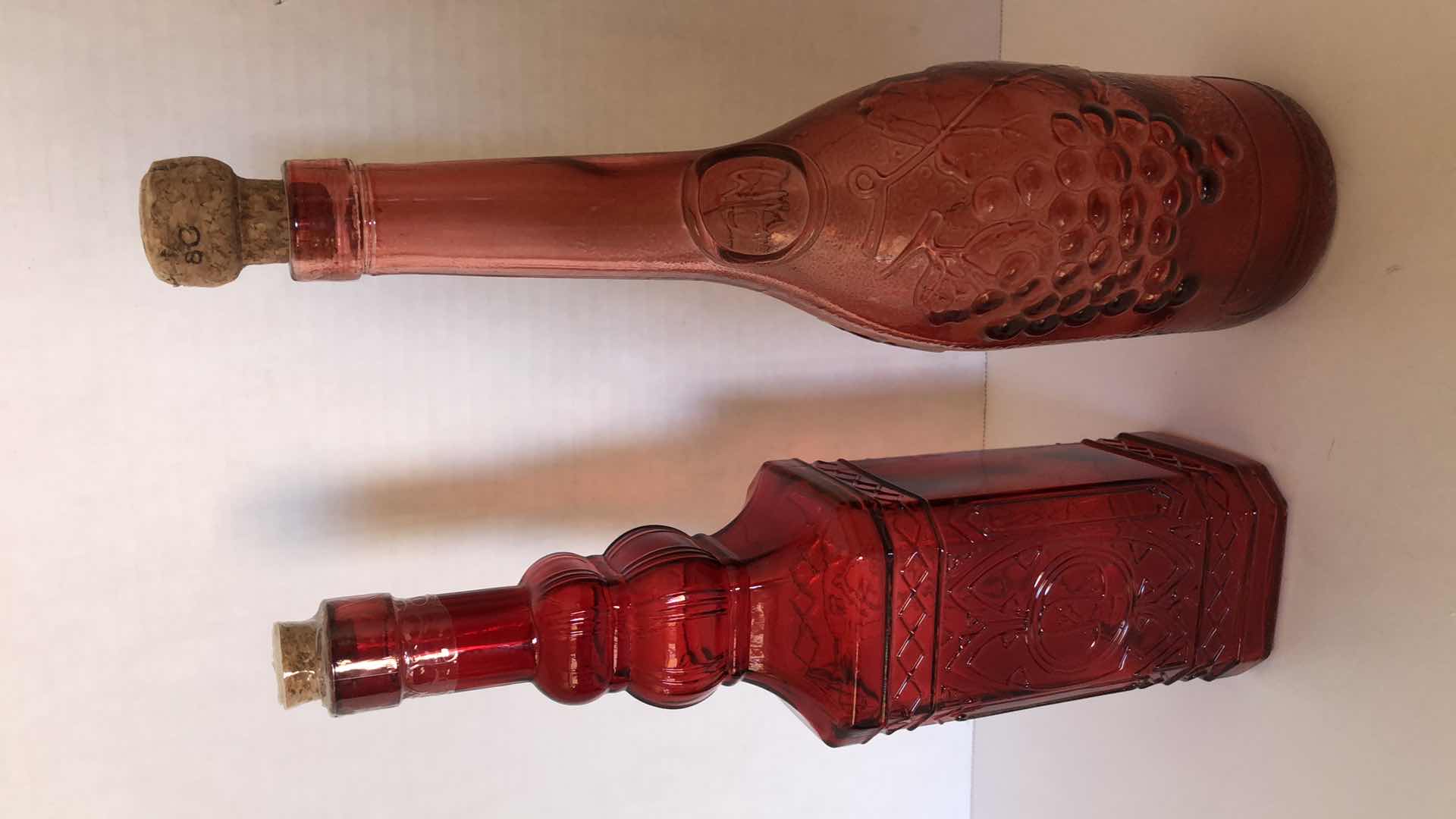 Photo 1 of RED GLASS BOTTLES