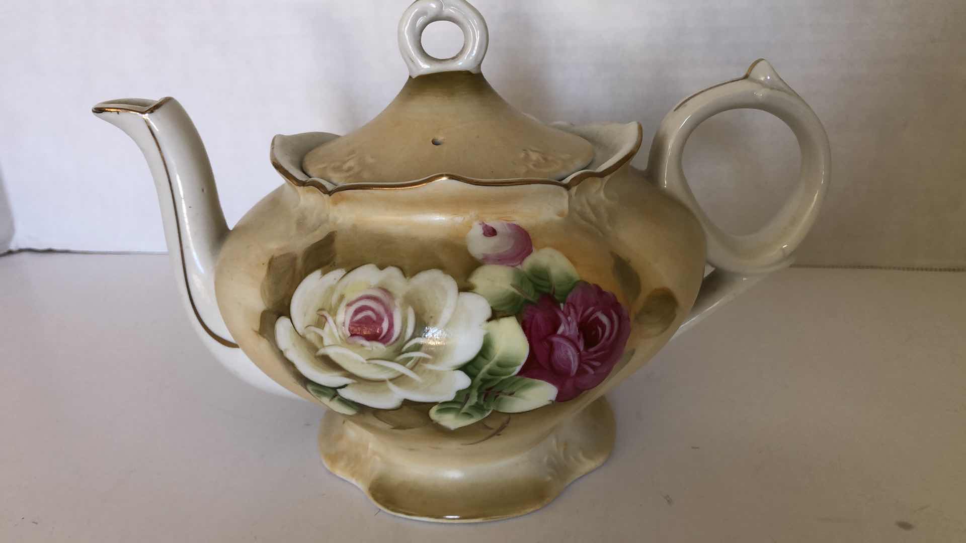 Photo 1 of MUSIC BOX TEA POT