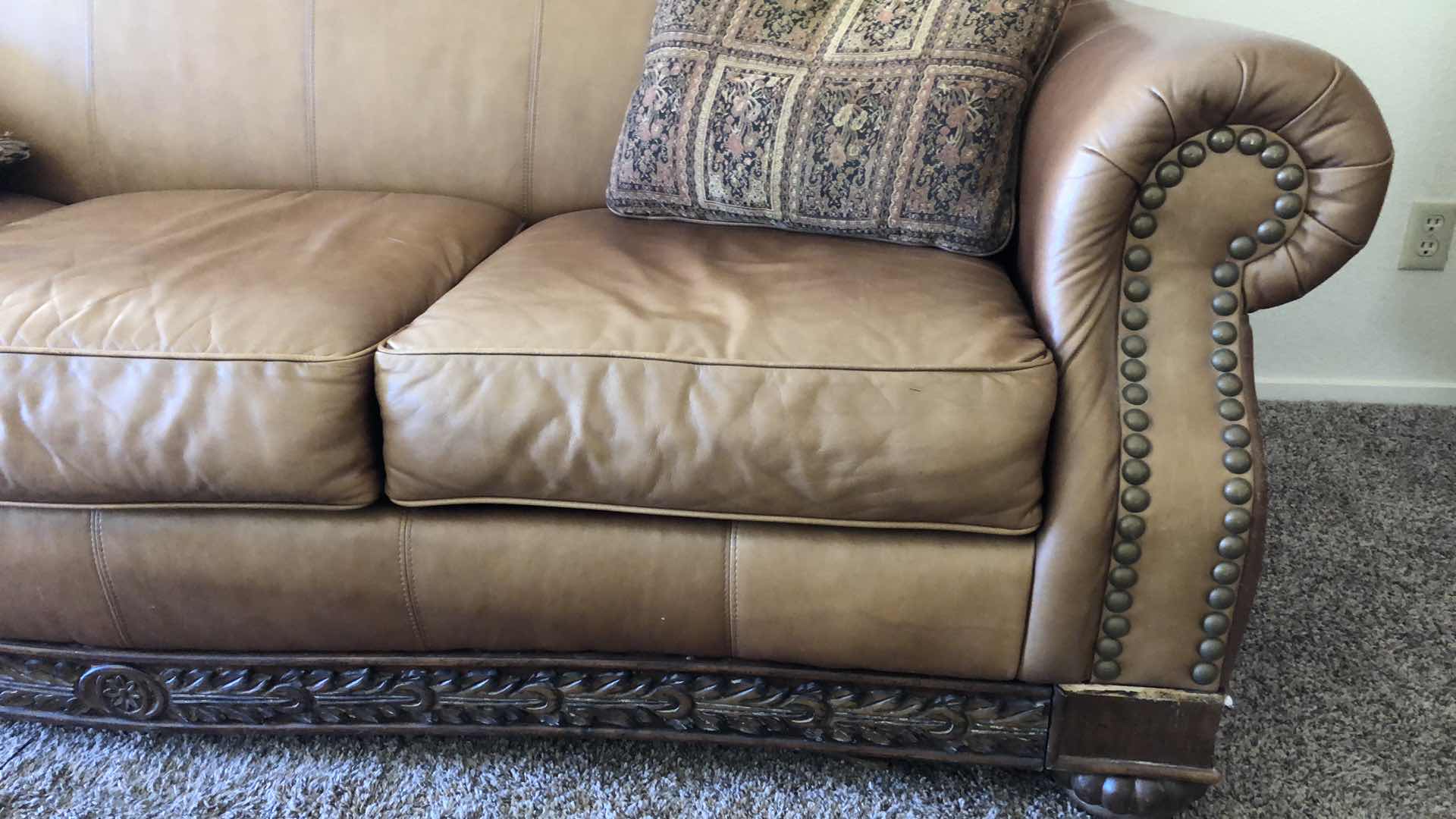 Photo 2 of BROWN LEATHER SOFA W NAIL HEAD TRIM 84” X 38” H 39”