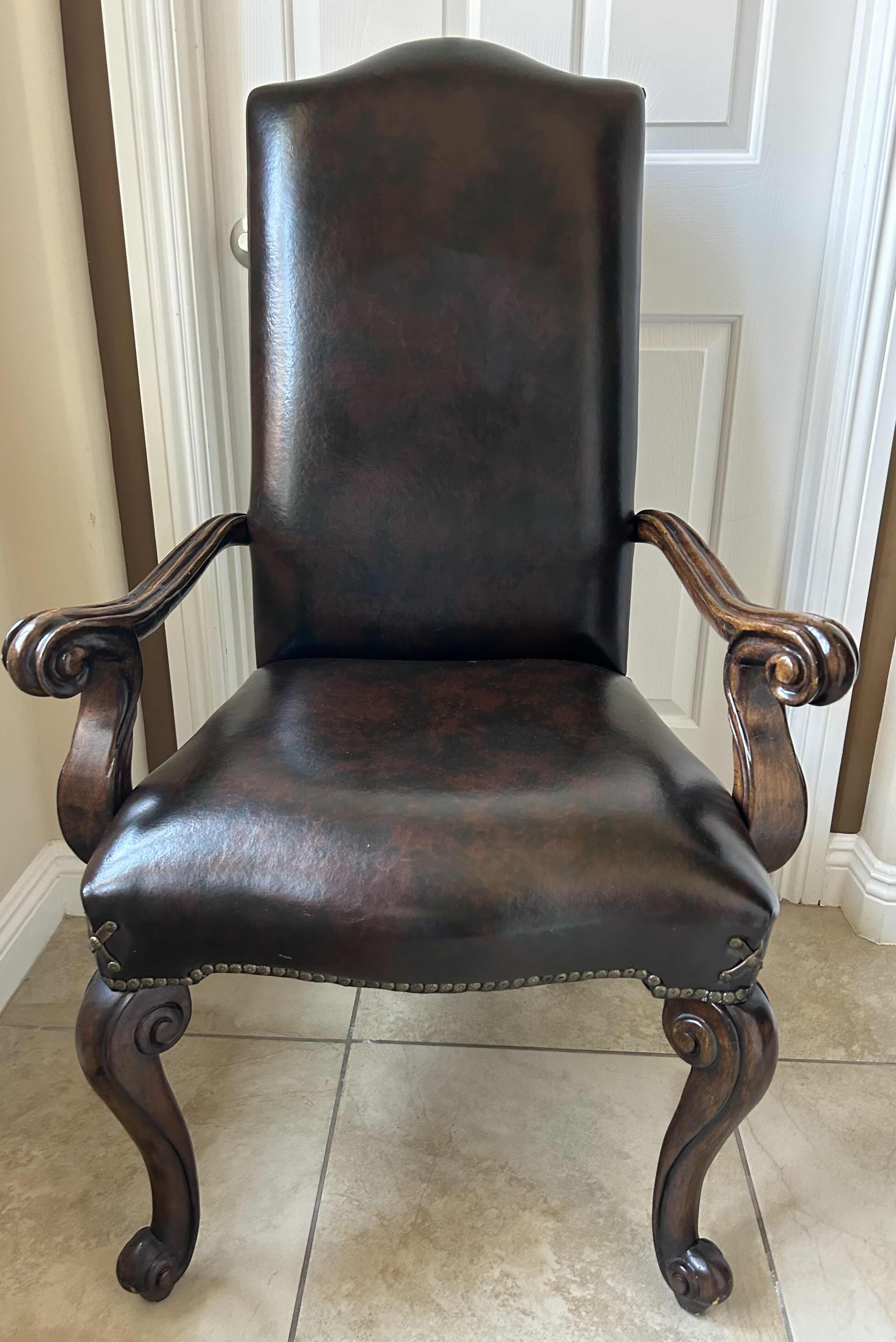 Photo 2 of LEATHER DINING ARMCHAIR WITH CROSS DETAIL ON CORNER AND STUDS EMBELISHMENT 28” x 29” x 45
