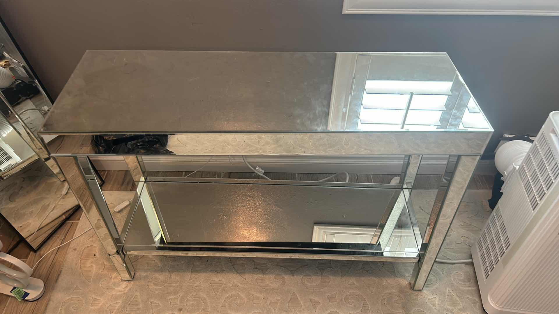 Photo 2 of A MODERN CHROME MIRRORED ENTRY TABLE OR CONSOLE WITH DIMENSIONS OF 44" X 15" X H 30".