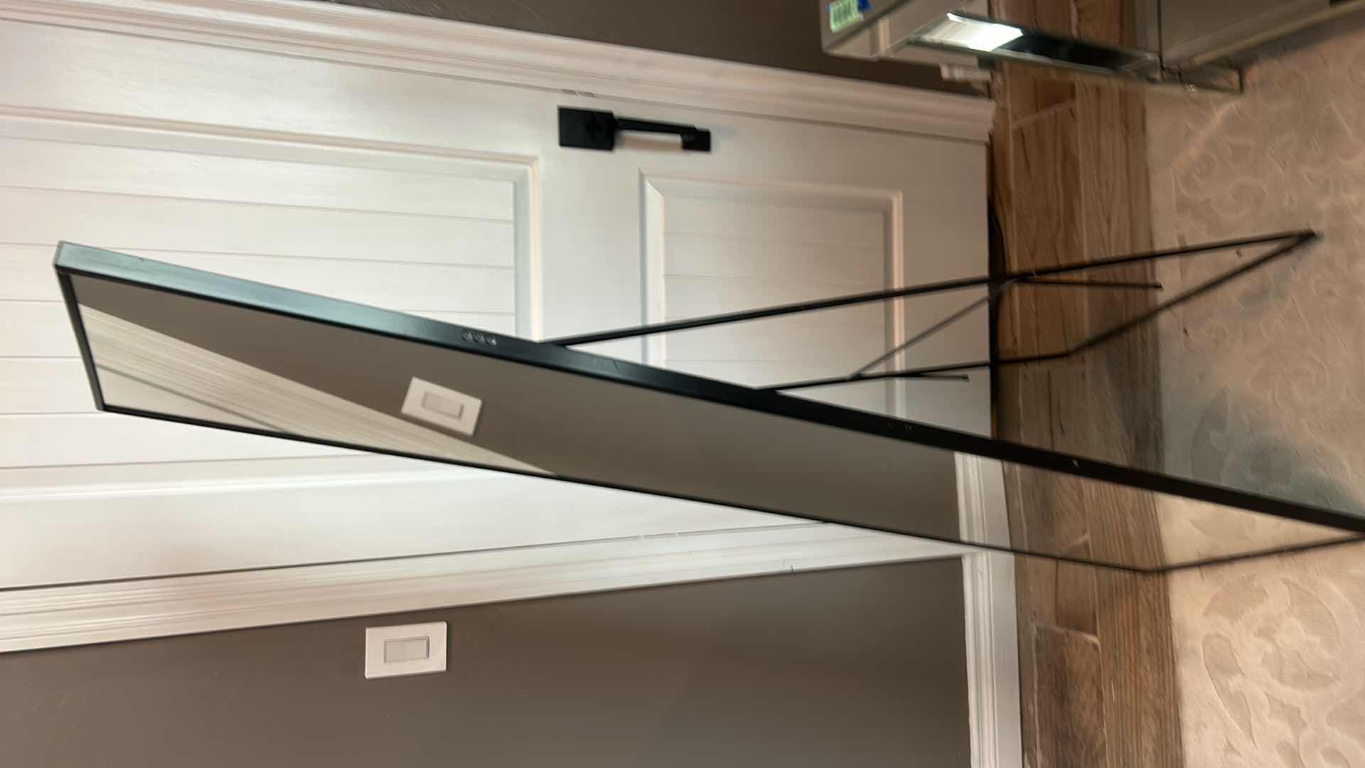 Photo 2 of A MODERN BLACK METAL WARDROBE MIRROR WITH DIMENSIONS OF 40" X H64".