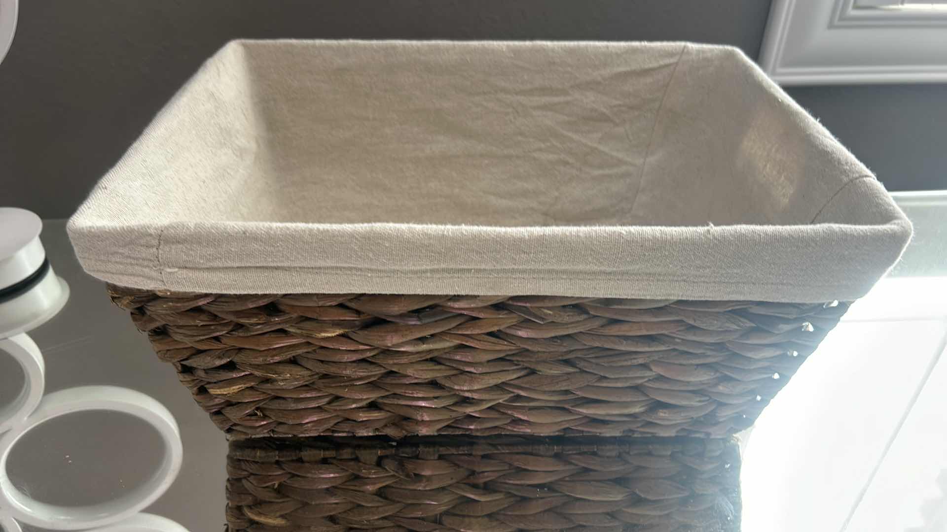 Photo 5 of FOUR WOVEN WICKER STORAGE BASKETS, THREE OF WHICH ARE COLLAPSIBLE.