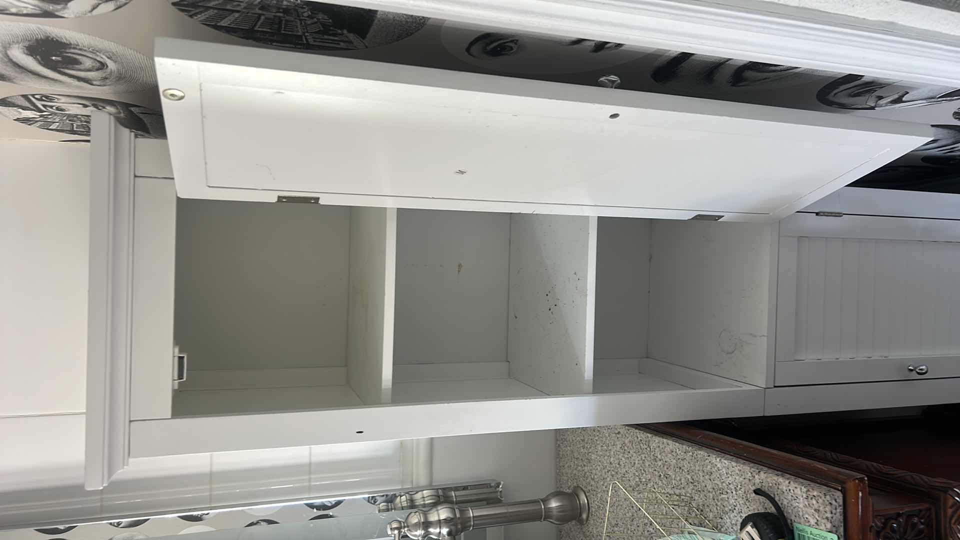 Photo 2 of WHITE, NARROW STORAGE CABINET. 12" X 13.5" X H. 63.25".