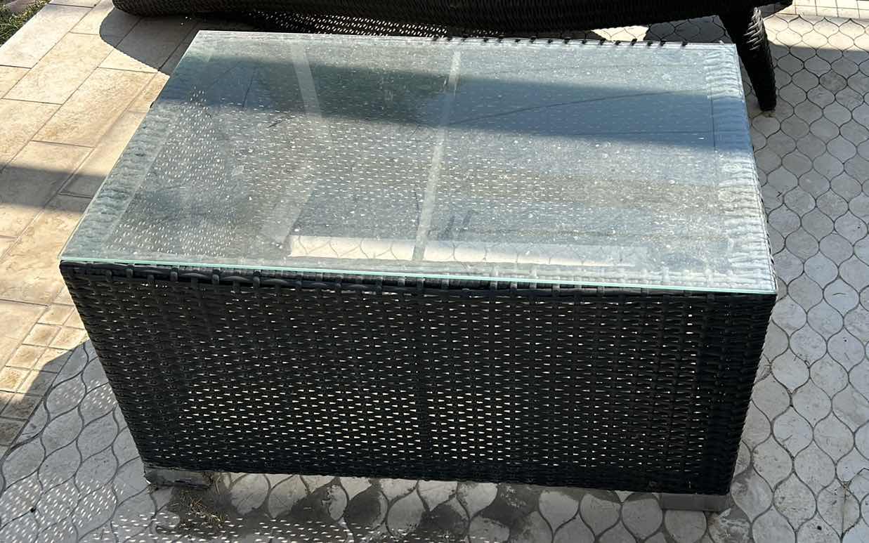 Photo 1 of OUTDOOR FURNITURE FAUX RATTAN COFFEE TABLE WITH GLASS TOP 34" X 22 1?4" X 18 1?4".