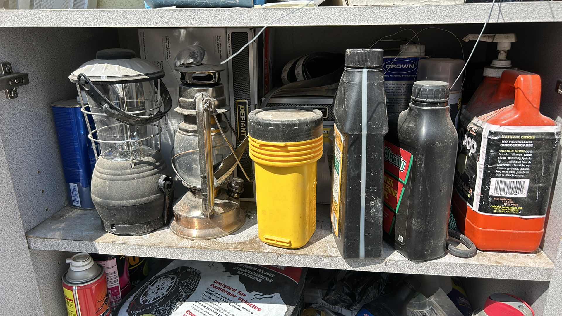 Photo 2 of CONTENTS OF CABINET- LANTERNS, OUTDOOR SUPPLIES , CLEANING SUPPLIES AND MORE