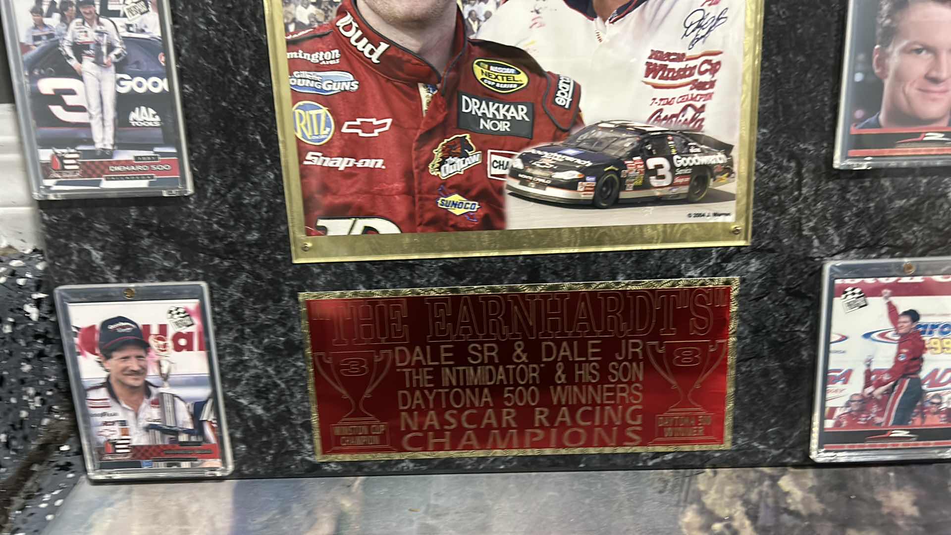 Photo 3 of DALE EARNHARDT COLLECTIBLE MEMORABILIA, SPORTS CARDS, AND MORE. 18“ x H16“