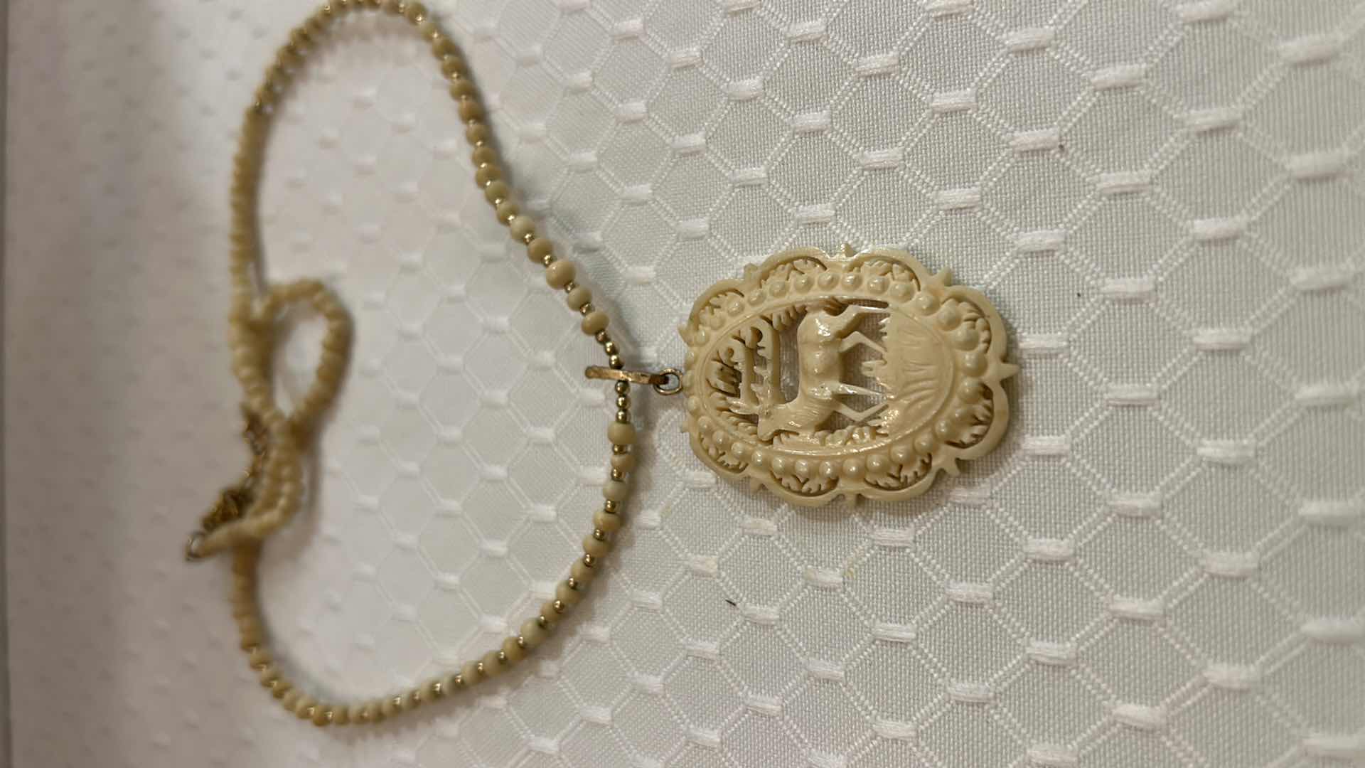 Photo 2 of JEWELRY- VINTAGE CARVED IVORY REINDEER NECKLACE.