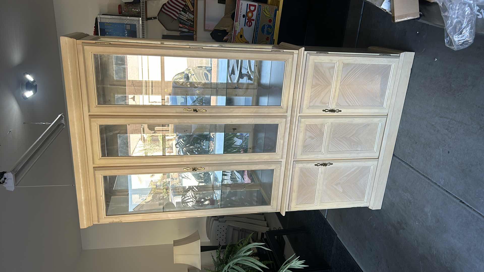 Photo 2 of HOME FURNISHINGS - LIGHT WOOD CURIO/CHINA CABINET WITH TWO GLASS SHELVES AND TWO DRAWERS. 42” X 15” X 79”.