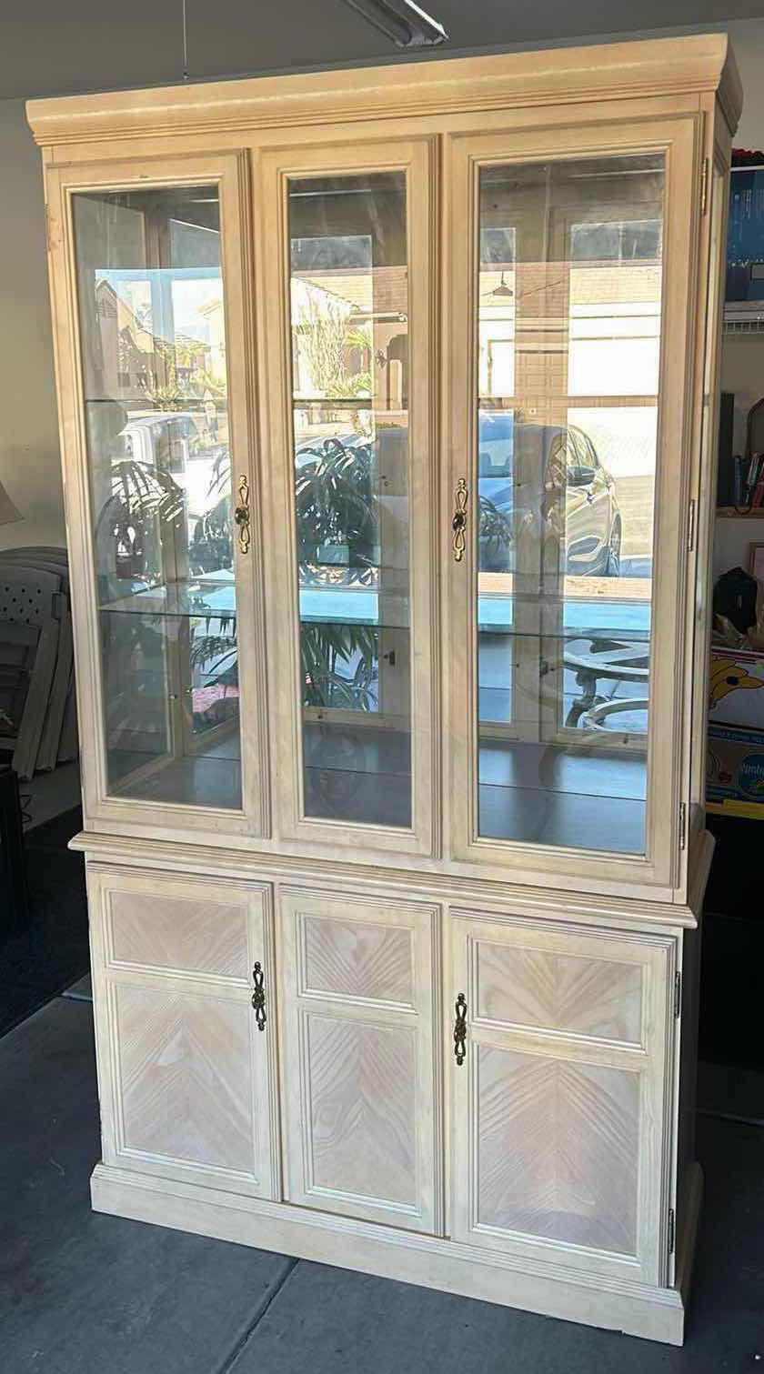 Photo 1 of HOME FURNISHINGS - LIGHT WOOD CURIO/CHINA CABINET WITH TWO GLASS SHELVES AND TWO DRAWERS. 42” X 15” X 79”.