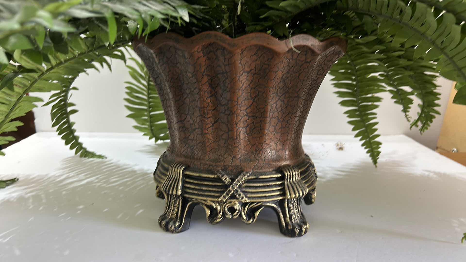 Photo 2 of HOME DÉCOR. BEAUTIFUL, ORNATE POT WITH FAUX FERN PLANT. 32” x H23”